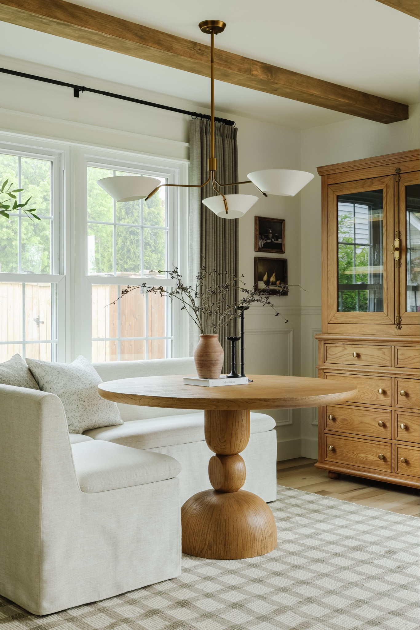 Dining room furniture, round dining table, wood dining table, pedestal dining table, upholstered bench, storage bench, slipcovered bench, wood hutch, wood display cabinet, contemporary chandelier, transitional chandelier

#LTKHome #LTKFamily