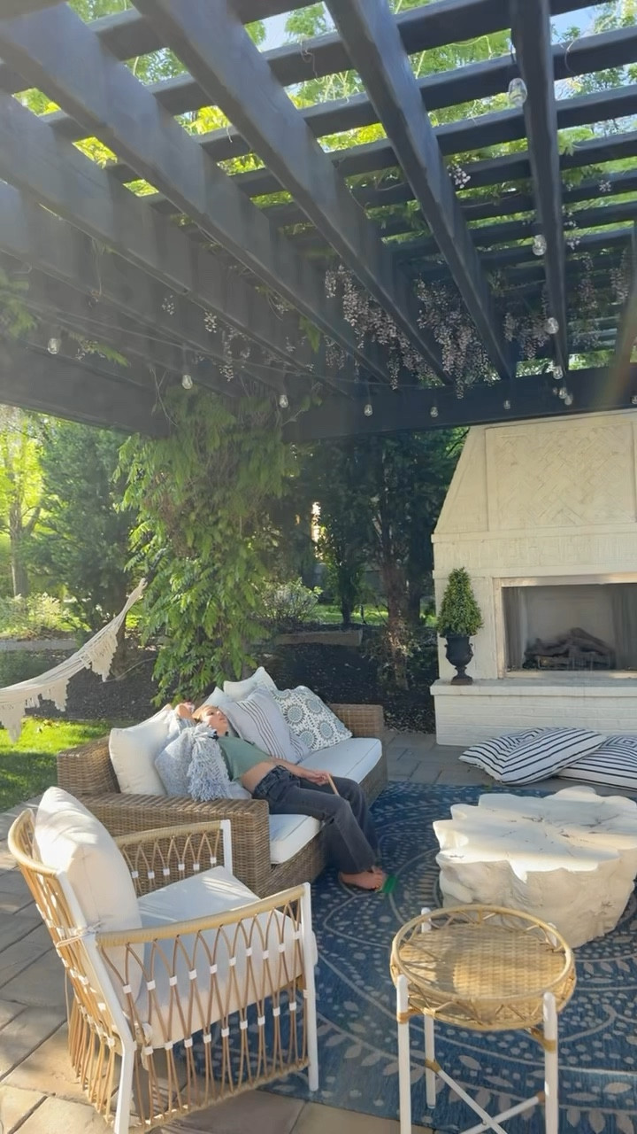 Our patio is in full bloom! Outdoor sofas, Serena & lily dupe chairs, outdoor pillows, rug, and live edge coffee table all linked for you here. We love our floor cushions too and they have a handle for carrying food the beach as well. 
Faux boxwoods look like the real thing! 

#LTKHome #LTKSeasonal #LTKSaleAlert