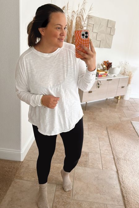 my all time favorite long sleeve tee. works with jeans, leggings, joggers. the perfect layer underneath vests, sweaters, jackets. i wear the L and have every single color  

#LTKmidsize #LTKstyletip