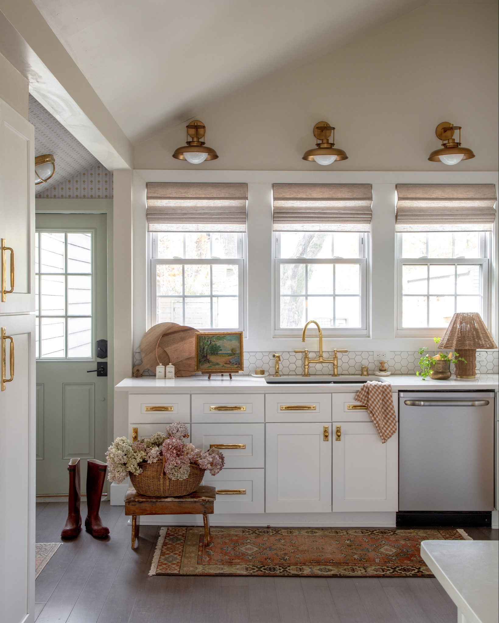 The Sage Home kitchen got a stunning upgrade thanks to Rejuvenation lighting, hardware, pot rail and faucet! 