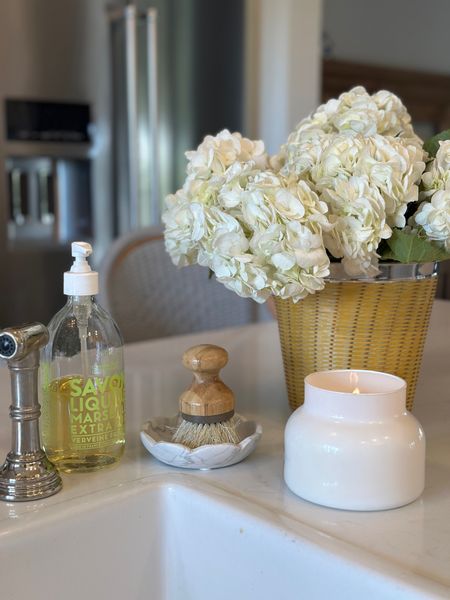 By my kitchen sink there is always a pretty hand soap, good candle, and fresh flowers.  I love this scalloped marble dish that holds my dish scrubber too 

#LTKhome