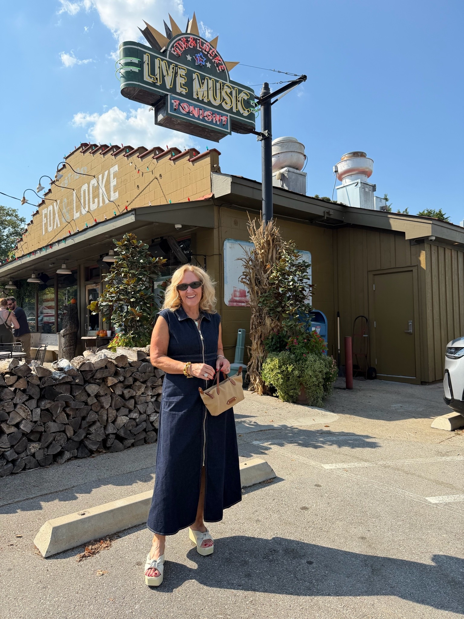 Out doing fall stuff in 103 degrees. Ugh. Perfect denim dress for that. Wearing a medium. 
I can’t link this pouch. It’s part of a purse from last summer, but I’ll find similar.

#LTKOver40 #LTKootd #LTKTravel
