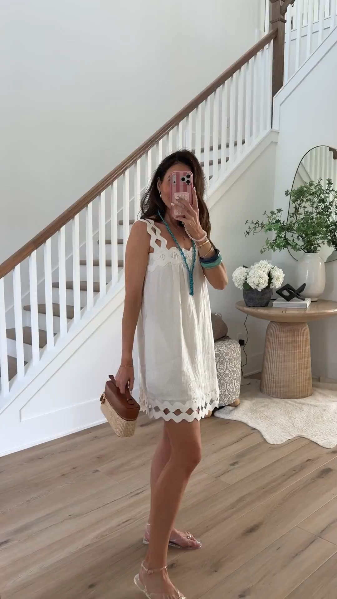 This white dress is so good. The cutout trim details, easy silhouette, and breezy fabric make it perfect for summer vacations, brunch dates, and warm weather events. I styled it with clear sandals, a woven bag, and a pop of turquoise for an effortless coastal chic look.

White summer dress, Vacation outfit, Resort wear, Coastal style, Summer dress outfit, Beach vacation look, Brunch outfit, Woven handbag, Clear sandals, Chic summer style, annabrstyle

#LTKmomlife #LTKTravel #LTKSeasonal