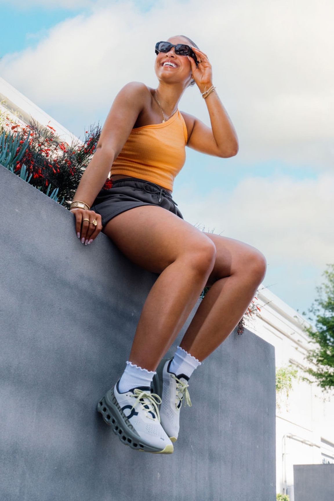 Orange one sleeve top x brown lounge shorts 

#LTKMostLoved #LTKStyleTip #LTKActive