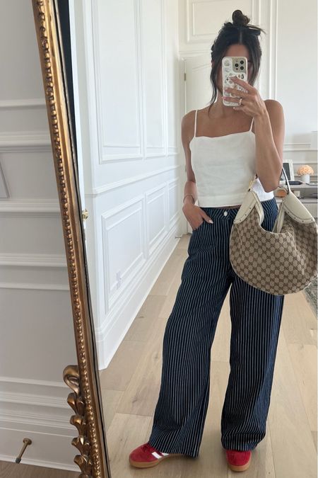 Casual spring outfit ❤️ loving these new pinstripe wide leg pants 

Spring outfit, cotton on, striped pants, wide leg pants, work pants, Gucci bag, white tank, white cami, red adidas, adidas samba, summer outfit, date night outfit, girls night outfit, work outfit, Christine Andrew 

#LTKfindsunder100 #LTKstyletip #LTKSeasonal