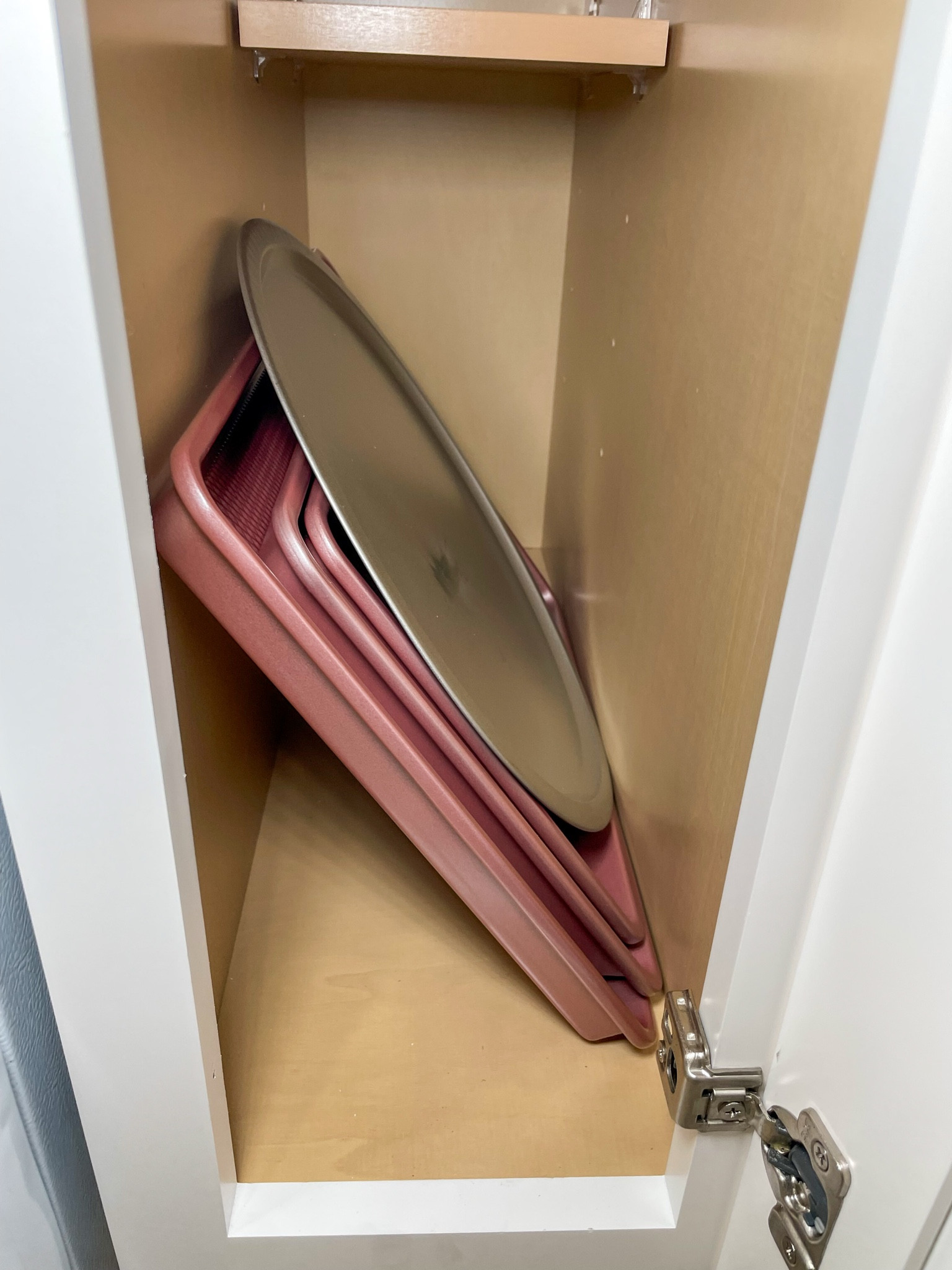 Rose gold bakeware stored and ready for guest use