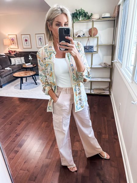 STYLE TIP TO WEAR CARGO PANTS  
✨I wanted to try the cargo pants trend, but definitely don’t want to look frumpy. Since cargos are a little bulky on the bottom, I balanced the proportions with a fitted top. I added this gorgeous print button down to finish the look and add interest. What do you think of this spring outfit? I’m slightly obsessed!

Fit is true to size. Cargos come in other colors too!

#LTKstyletip #LTKover40 #LTKSeasonal