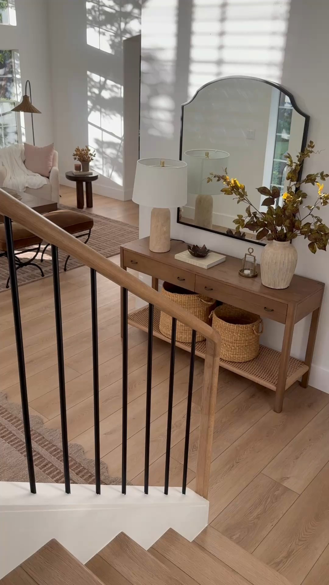 Simple but warm console table styling for fall. Loving the earthy, organic feel with a mix of textures and natural elements—woven baskets, travertine lamp, brass candle holder, metal statement mirror, ceramic vase, realistic fall stems  

Afloral fall stems are 25% off with code LASTCALL until Sep 7th  

#LTKHome #LTKSeasonal #LTKStyleTip
