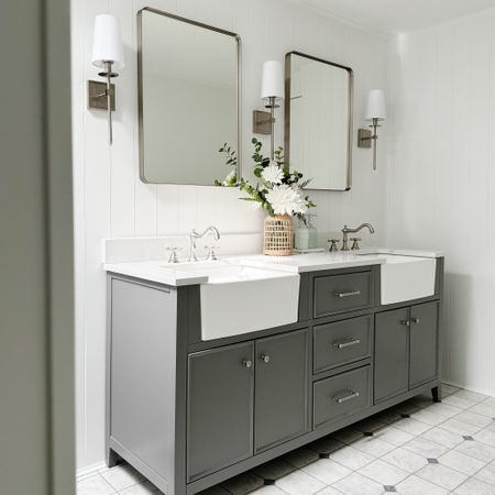 We recently finished our grandparents lake house bathroom remodel. We wanted it to feel like a getaway and speak to the styles they love. These finishing touches did just that. Farmhouse sink vanity. Brushed nickel sconces. Brushed nickel bathroom mirrors. Victorian bathroom faucets. 

#LTKfamily #LTKfindsunder100 #LTKhome