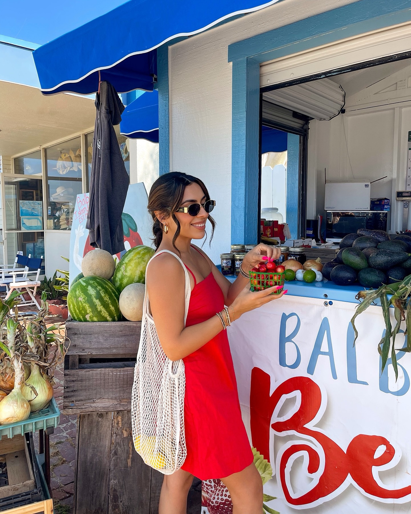 picking some fresh fruit on a summer day 🍒☀️♥️
—
outfit will be linked in my @shop.ltk 
dress: @abercrombie 
sandals: @jcrew 
—
colorful style, summer outfit, classic style, summer poses, Pinterest girl, fruit stand, red dress, summer hairstyle