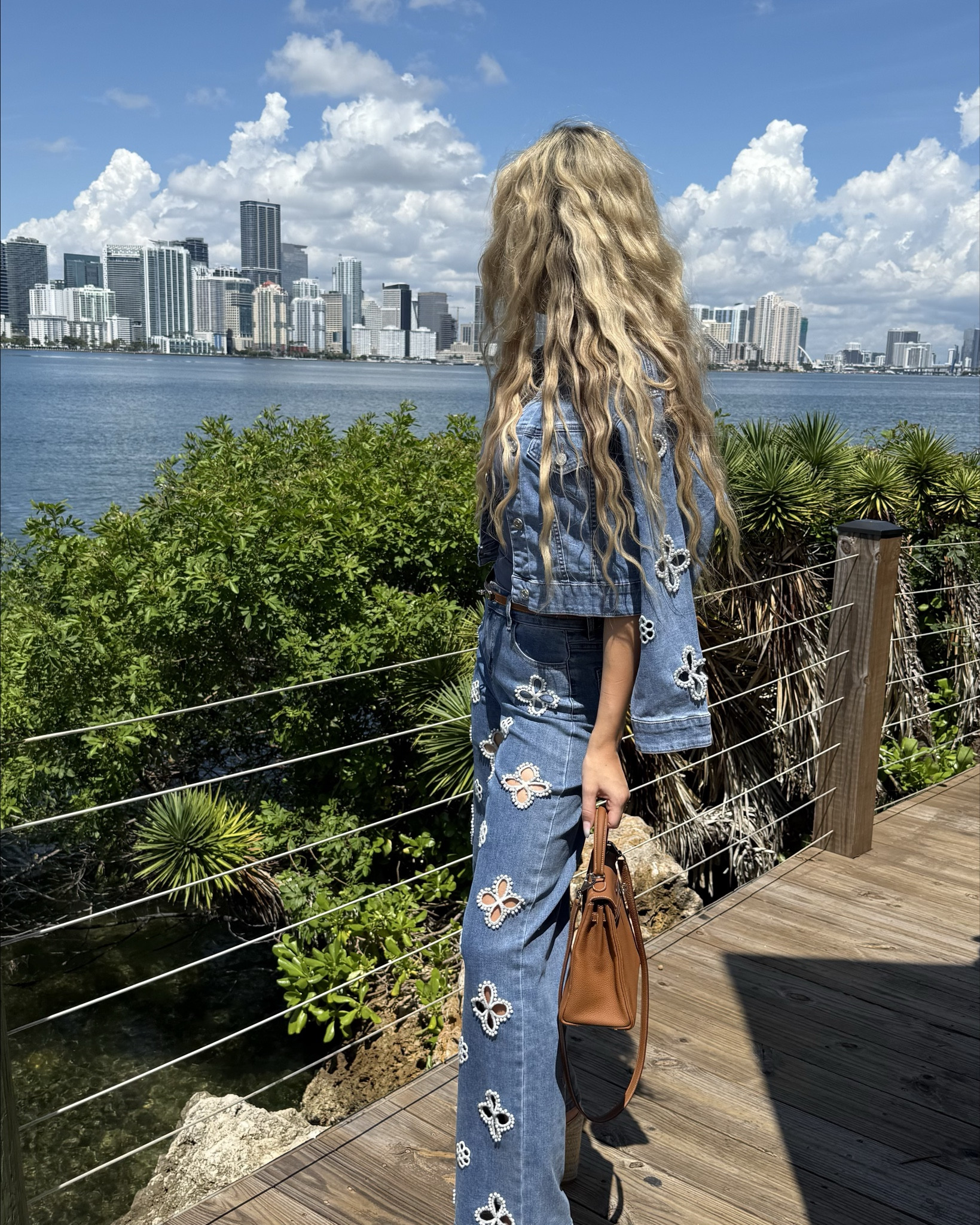The matching denim set of my chic dreams from the Noli shop. Perfect for transitioning into fall. Love the flower pearl details. Wearing a size S in the jacket and 25 in the pants. True to size - for a more oversized fit - you could definitely size up!💙 Styled the look with stylish details, wearing my new white Saint Laurent tribute wedges and wavy hair with my new hair waver (such a good find!) 

#LTKShoeCrush #LTKSeasonal #LTKStyleTip