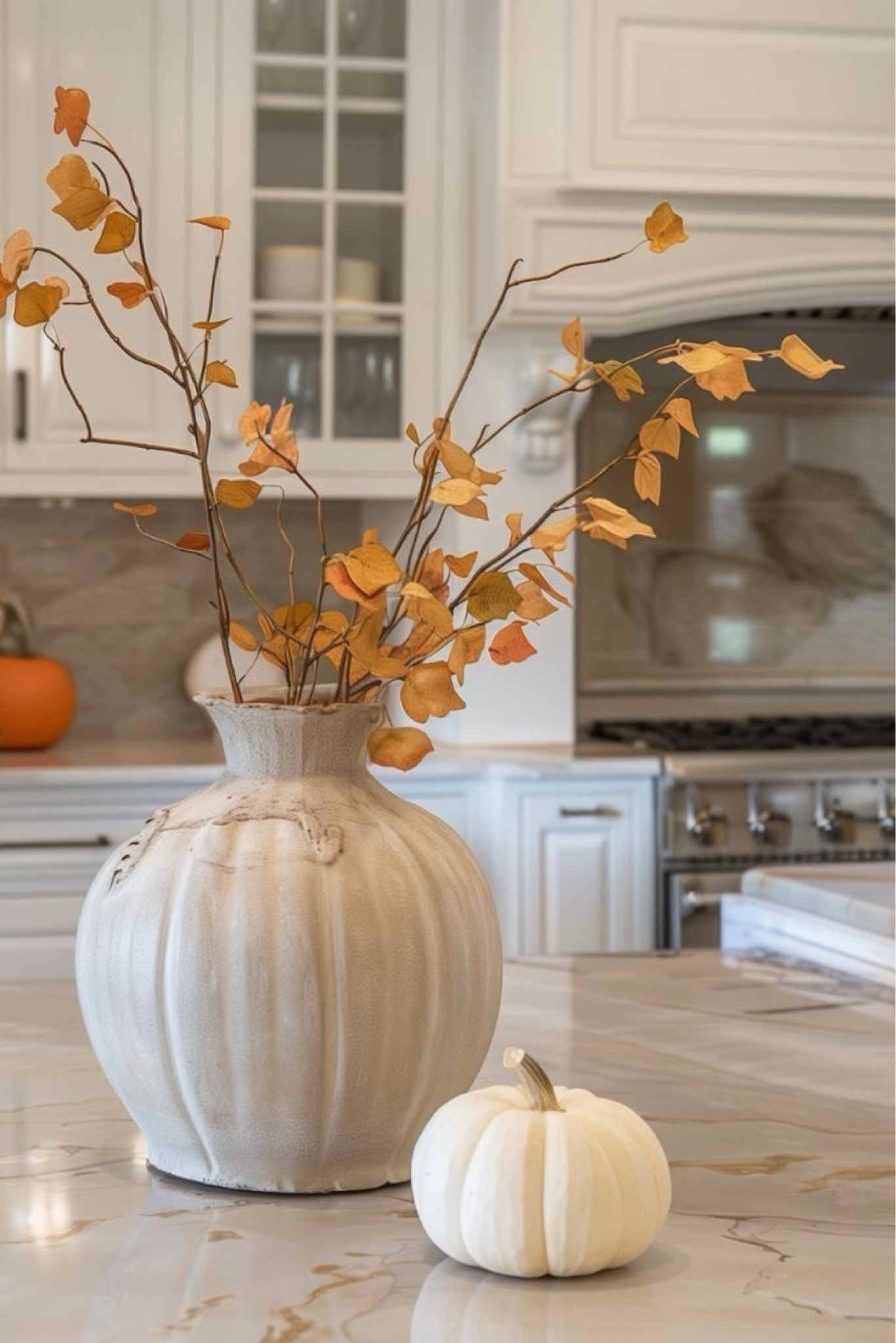 Cozy Fall decorating, Fall kitchen decor Fall foliage in ceramic vase beside pumpkins . Thanksgiving decor ideas. Thanksgiving table decorations, centerpiece ideas. Easy Fall decorating ideas.

#LTKHoliday #LTKHome #LTKSeasonal