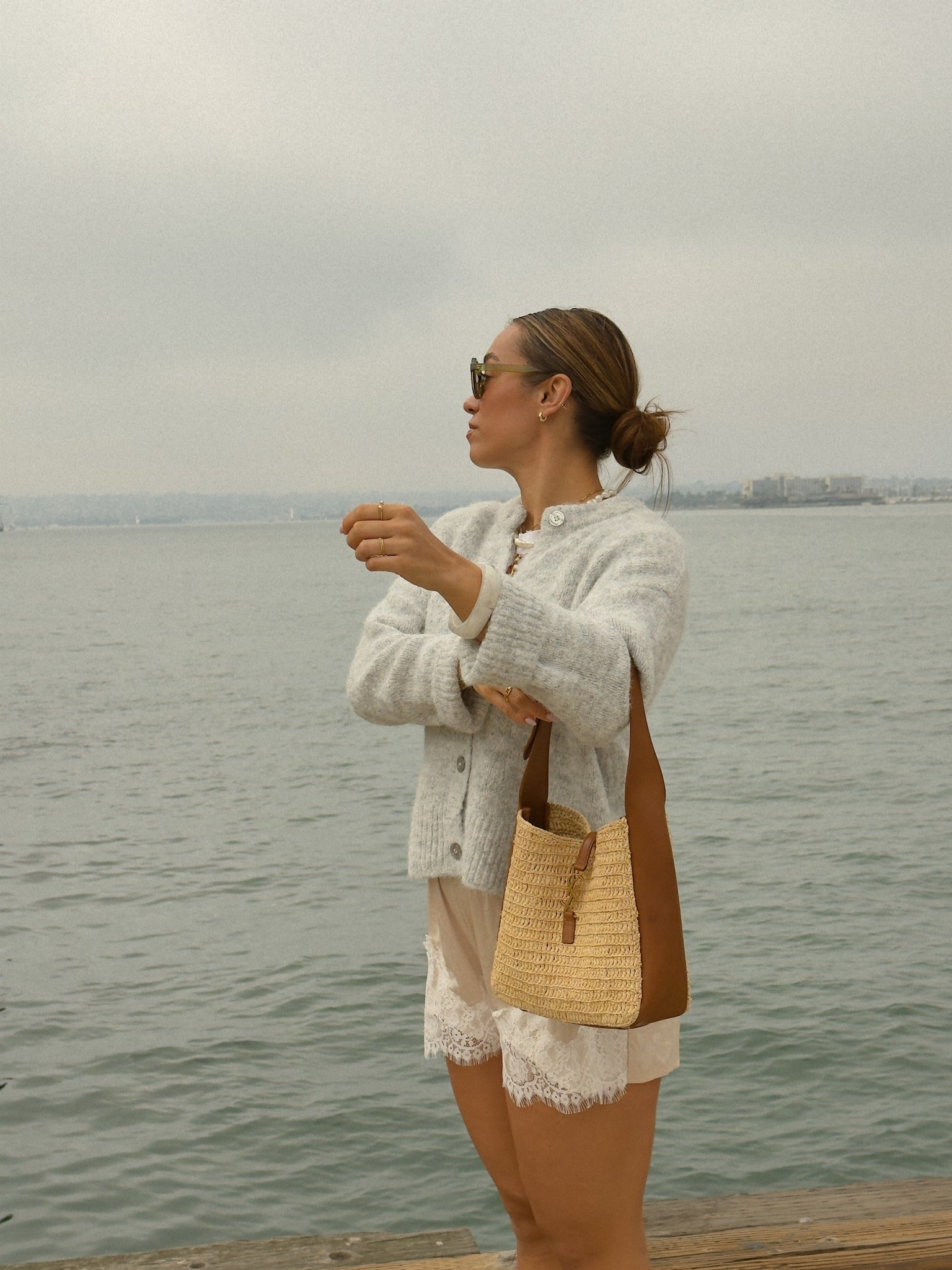 ootd for a chilly overcast day exploring San Diego. I’m loving the chunky knit sweater with lace satin shorts trend for a cute fall outfit 

Wearing size small in the oversized cardigan and medium in the shorts 

#LTKootd #LTKFindsUnder100 #LTKTravel