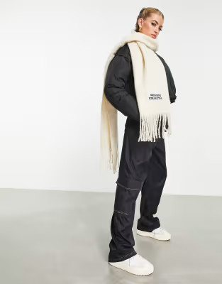 ASOS Weekend Collective woven fluffy tassel scarf with logo in cream | ASOS (Global)