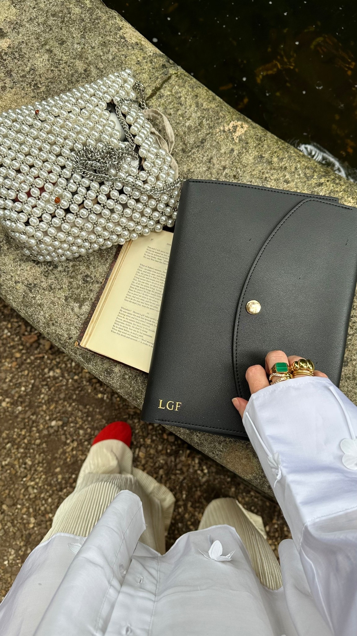 Clean lines, soft pearls and a ring stack that does all the talking - puffy croissant, green malachite signet, and a hint of sparkle. 👜💚✨
.
ring stack, puffy croissant ring, green malachite signet ring, diamante ring, statement rings, gold ring stack, colourful gemstone ring, summer jewellery style, elegant gold jewellery, outfit with jewellery focus, pearl bag style 

#LTKluxury #LTKautumn #LTKover50style