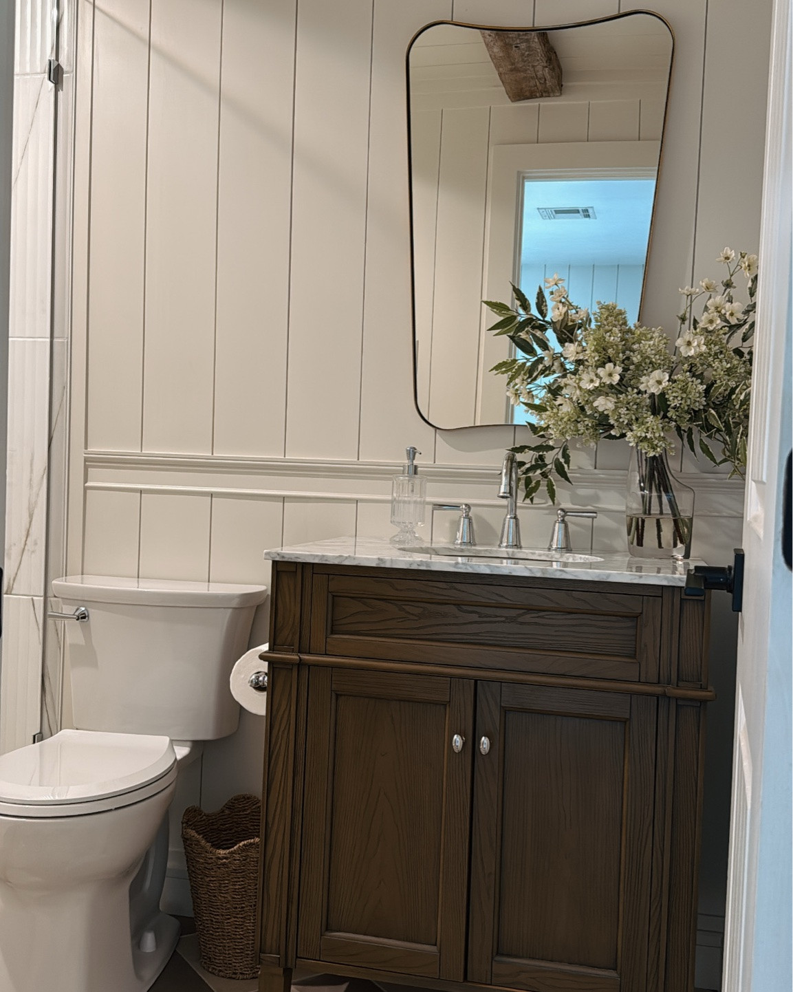 How CUTE is this scalloped wicker waste basket from @lowes !! Primary bathroom. Home decor. Checkered tile. Dark wood vanity. Brass handmade lighting from @Etsy

#LTKHome