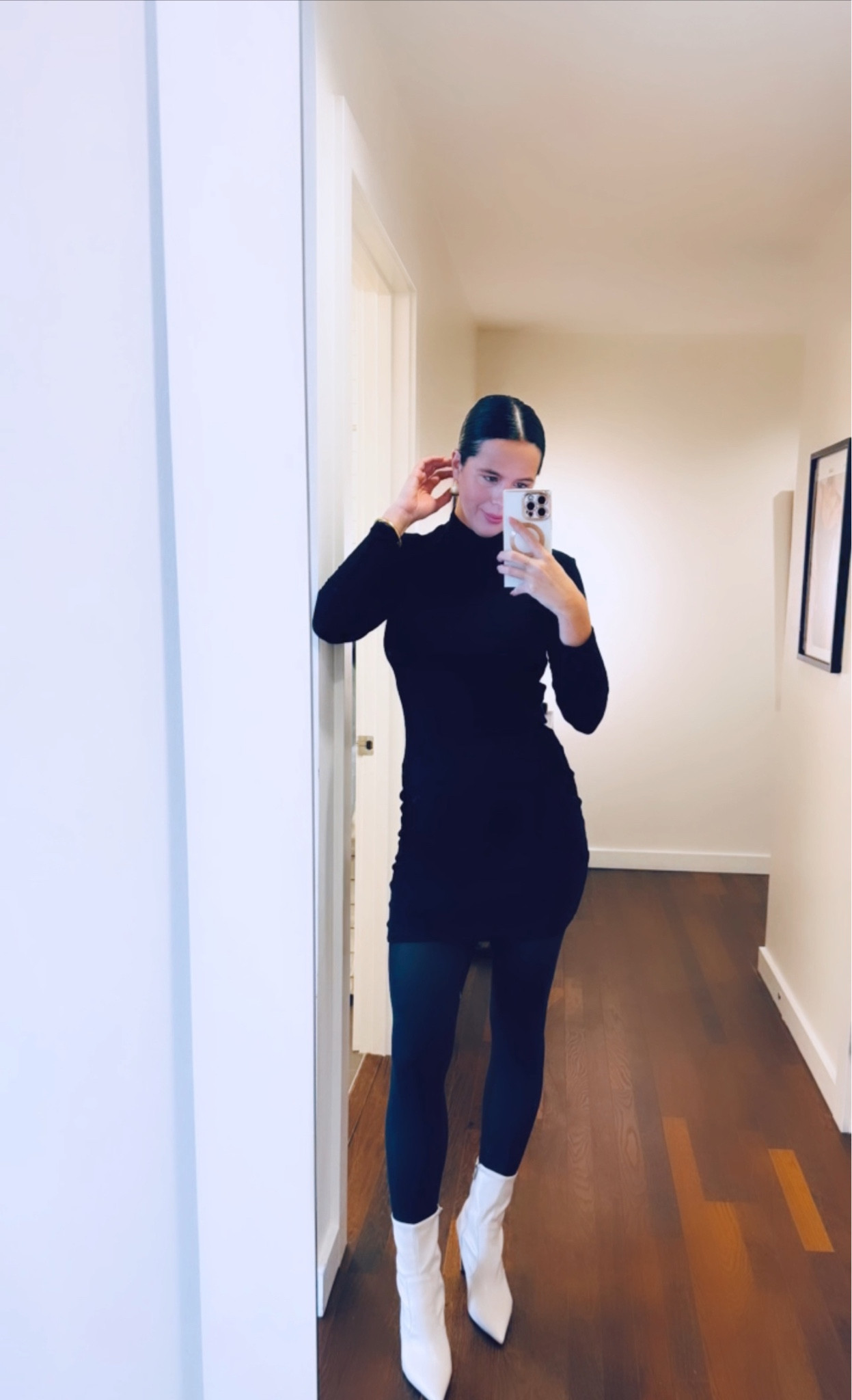 Tights under a turtle neck body con dress can be worn at any age at any time. Either wear an over the knee black or grey heeled boot or try this look with a crop white leather bootie. Now it’s your turn! Hair part down the middle, extra hair spray and pull that bun back tight. Gold thick small hoops are a must to compete this sophisticated yet fun black sleek style. Tip for body con, you can add a skims bodysuit underneath to enhance your curves where you want to show them. 
#turtlneckdress #bodyconandtights 

#LTKstyletip #LTKMostLoved #LTKworkwear
