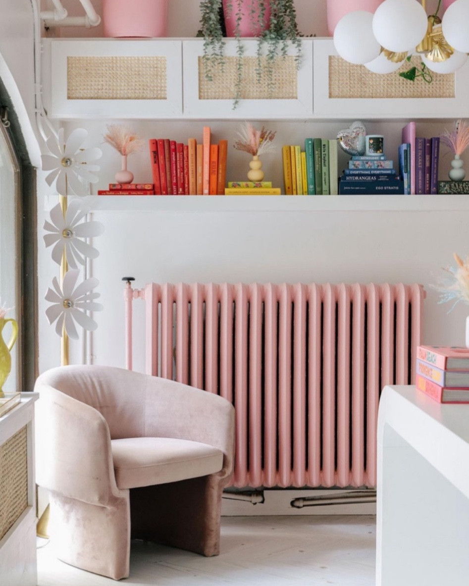 Pink entry way pink chair in living room rainbow book display 

#LTKhome