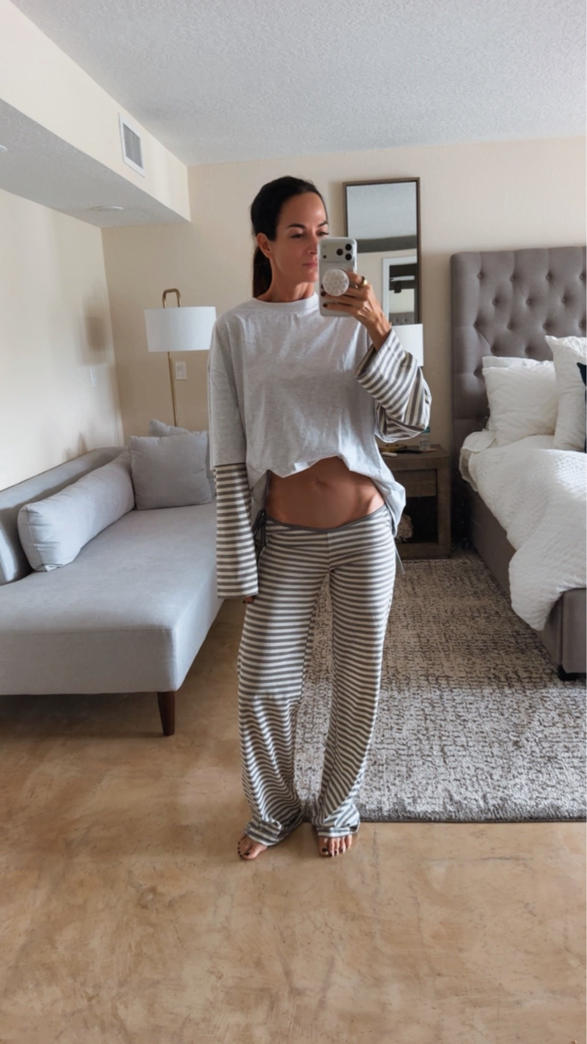 My staying-home wardrobe just got an upgrade 🤍 This relaxed gray top with striped sleeves has coordinating lounge pants AND drawstring shorts. Wear the top with denim or make it a matching-set moment. Linking the top and both bottoms here!

#LTKdayinmylife #LTKgrwm #LTKootd