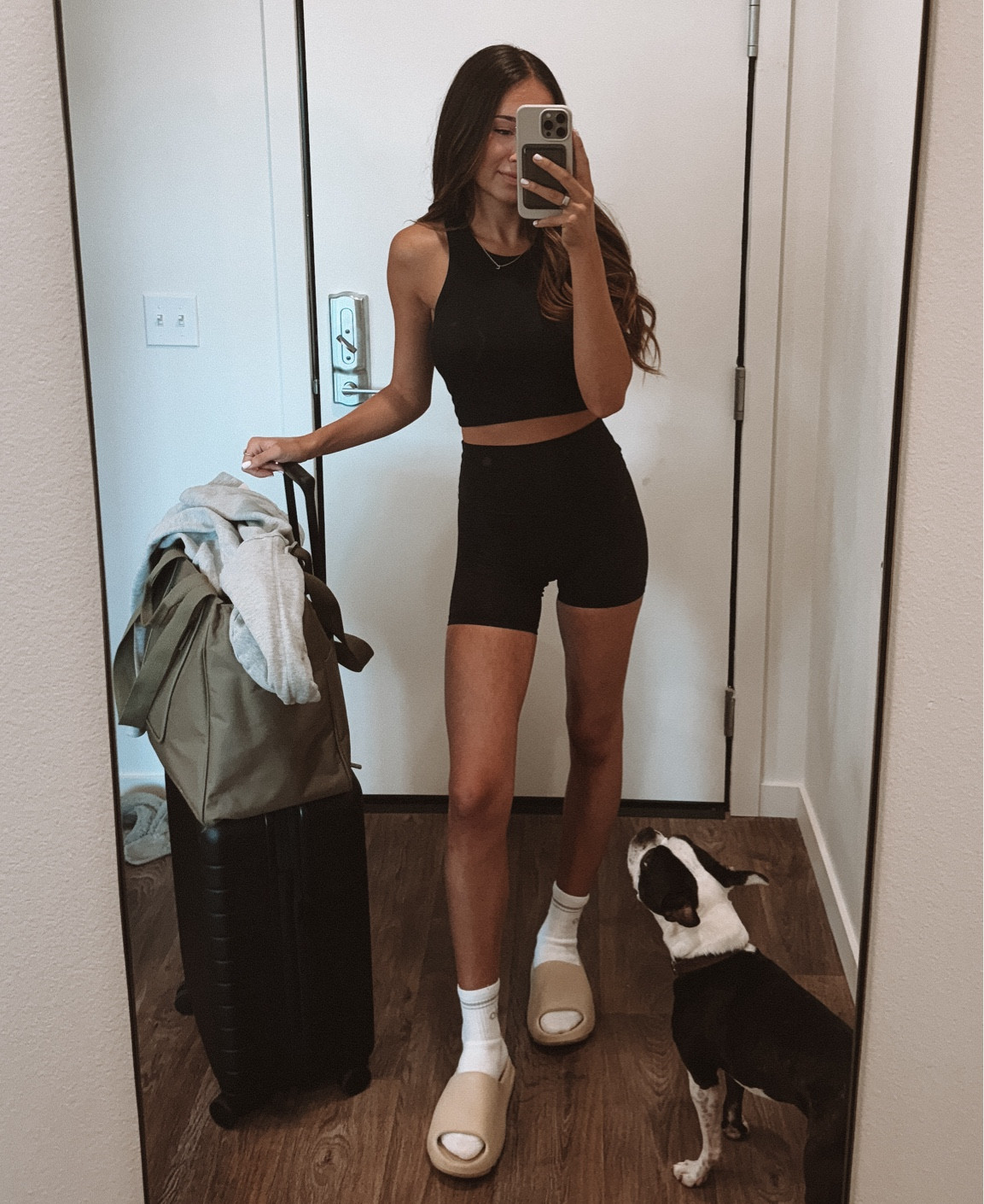 Travel day cozy outfit. Yeezy slides from GOAT. XS tank, size 2 in biker shorts, medium in ALO socks. 