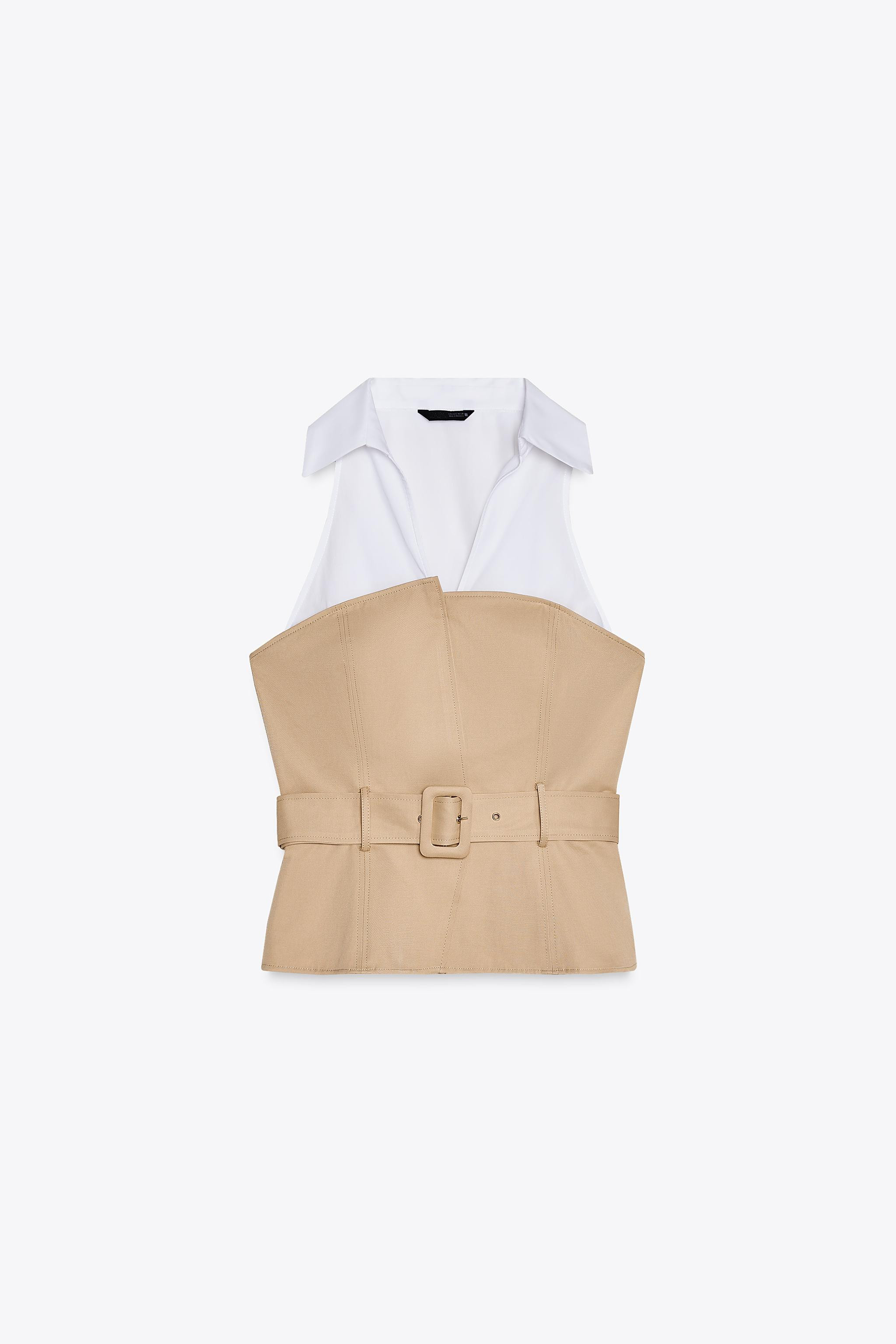 Halter neck top with lapel and V-neckline. Fabric combination detail and belt. Side hidden in-sea... | Zara US
