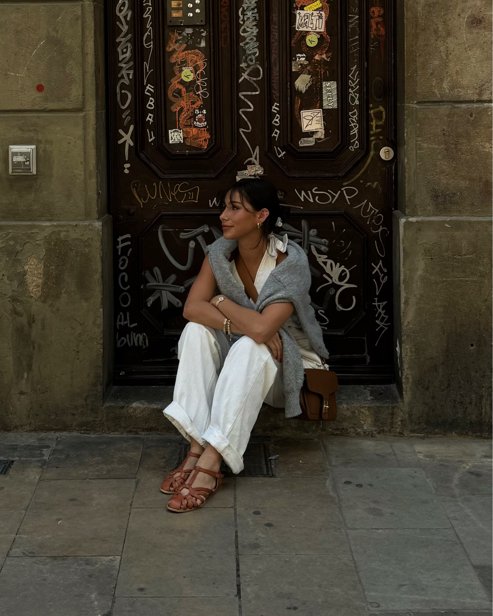 My Barcelona outfit 😍 this set is amazing because it can be made to be more summery or more city vibes depending on the accessories. I love n all white set! I paired it with this oversized sweater that’s a closet staple and tan shoes and bag to go for the European feel. Wearing size 0 in the top, sweater in size 2, and pants in size 0 (they run a little big). DC: DONNA20
