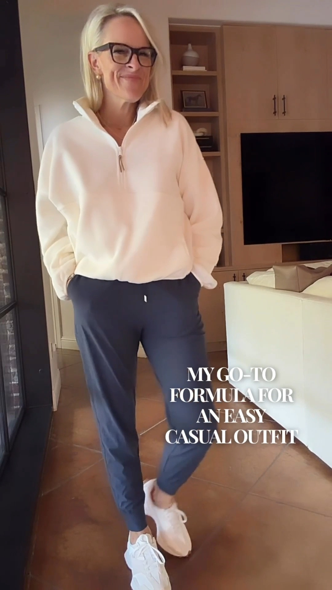 An easy everyday outfit that feels comfortable but still looks put together. This cream quarter-zip pullover paired with navy pants is such a classic combination for travel days, running errands, or a relaxed weekend.

The sneakers I’m wearing in the video are getting low in stock, so I’ve tagged another sneaker option that works beautifully with this outfit. I love having versatile basics like these that make getting dressed simple!