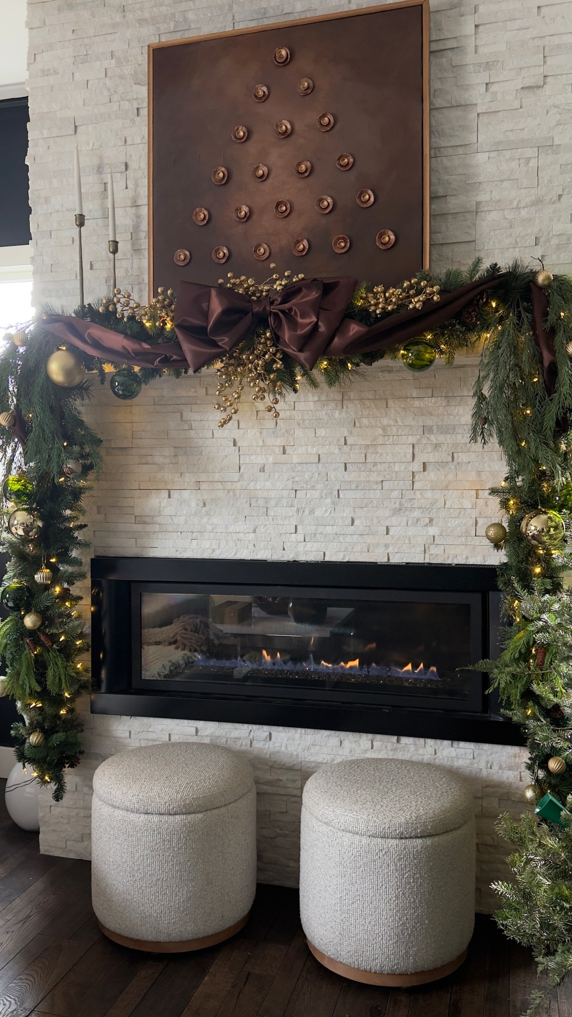Create Christmas magic in your home with affordable holiday decor.  Everything on this mantle is budget-friendly, and looks so beautiful. I used high quality thick pre-lit garland as the base.  Then created a bow using beautiful brown shimmery fabric. Added faux stems and ornaments and gold berry stems. Paired it with my DIY Christmas artwork above a simple brass candle holders to create this elegant mantel. Linking all my favorite Christmas decor for this mantle on LTK! 🎄✨#holidayhomedecor  #christmasgreenery #fauxgarland #christmascandleholders #christmascandles #neutraldecor #christmasinspo #budgetfriendly 

#LTKHoliday #LTKSeasonal #LTKHome