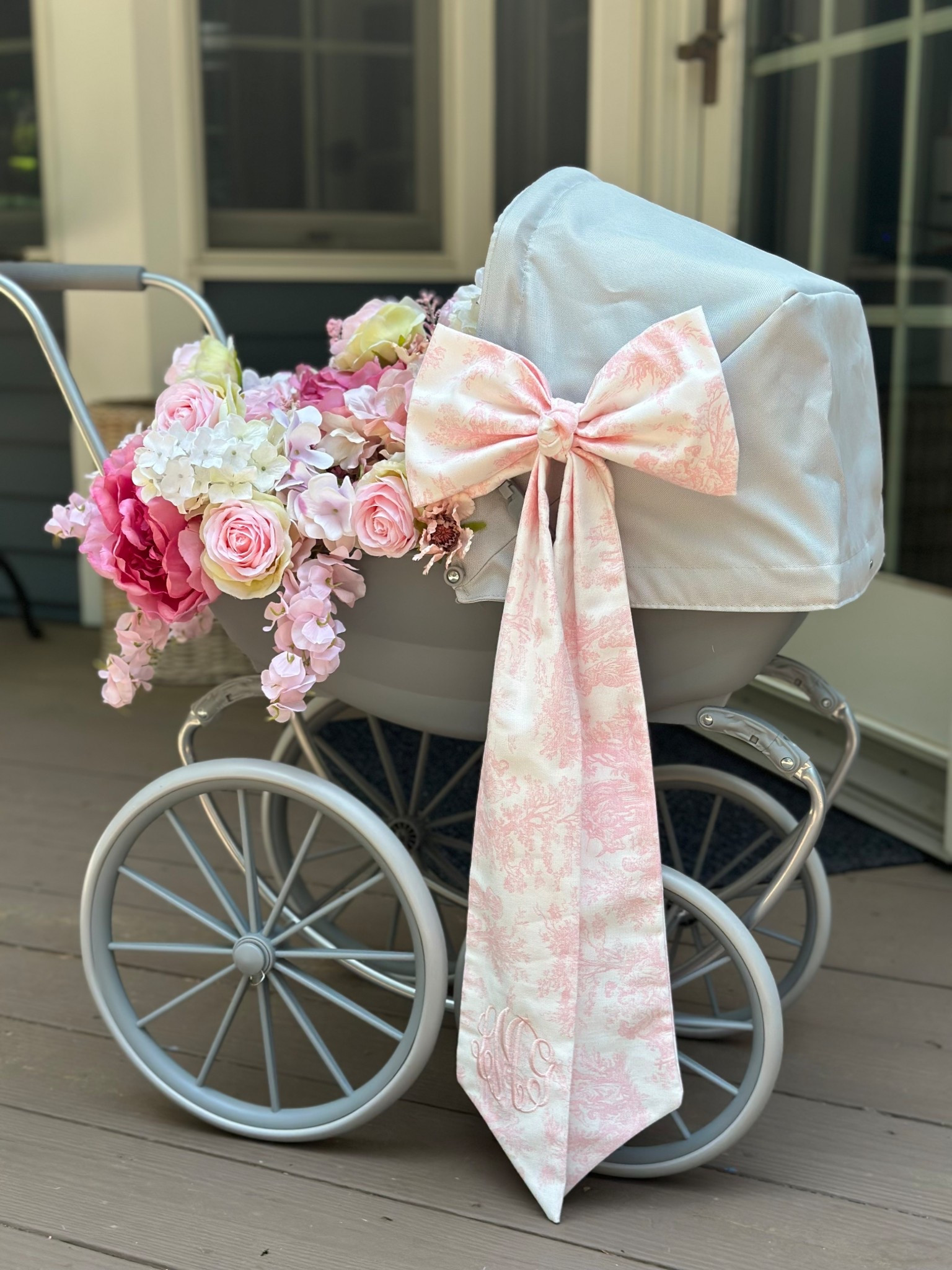 Faux floral arrangement in doll pram for birthday party decor or baby shower 

#LTKBaby #LTKParties #LTKFindsUnder50
