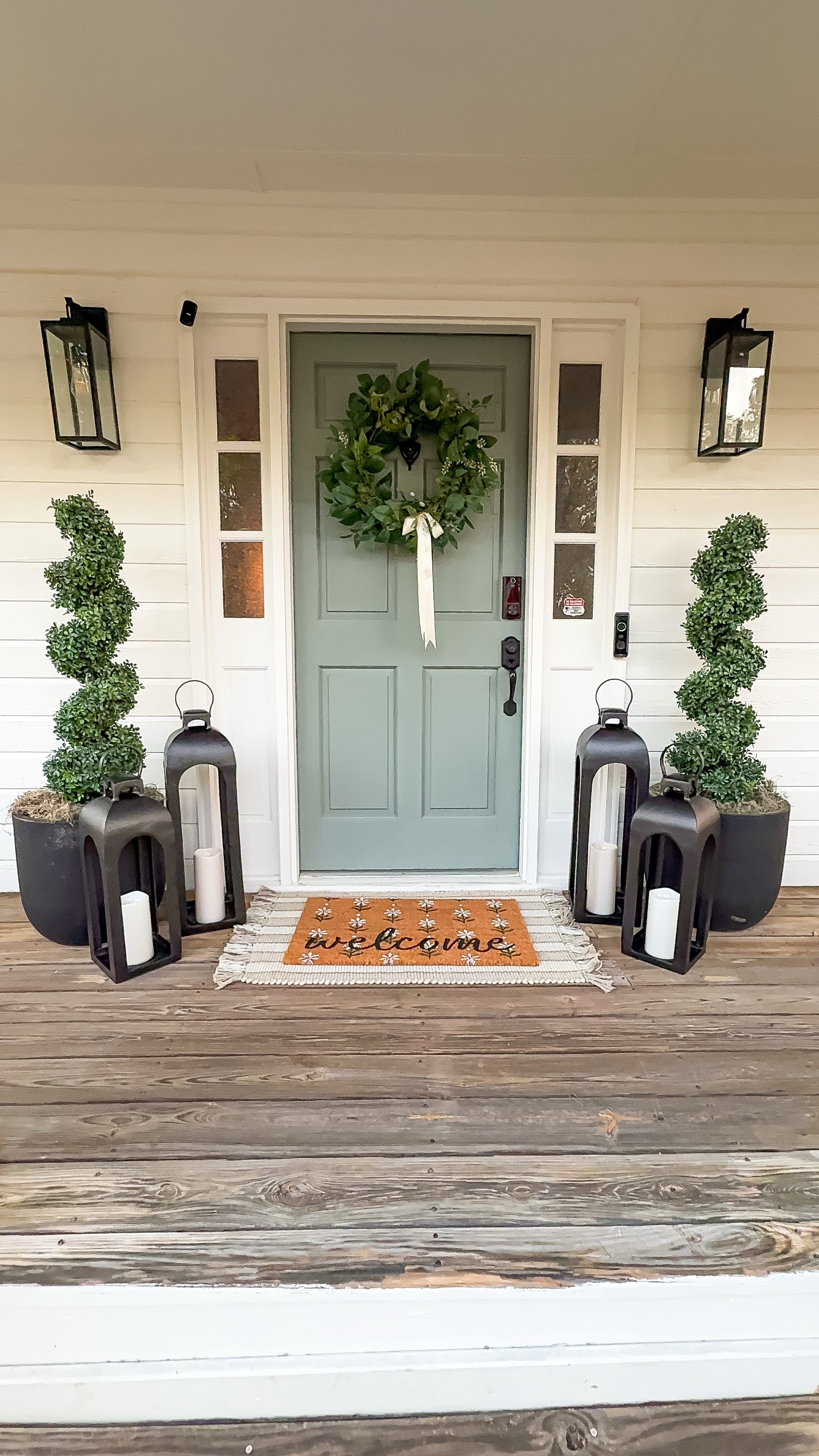 Spring front porch 

House: SW Pure White
Front door: PPG Gray Heron

Layered door mats, boxwood topiaries , black planters, lanterns , outdoor candles , wreath, satin bow 

#LTKSeasonal #LTKHome #LTKStyleTip