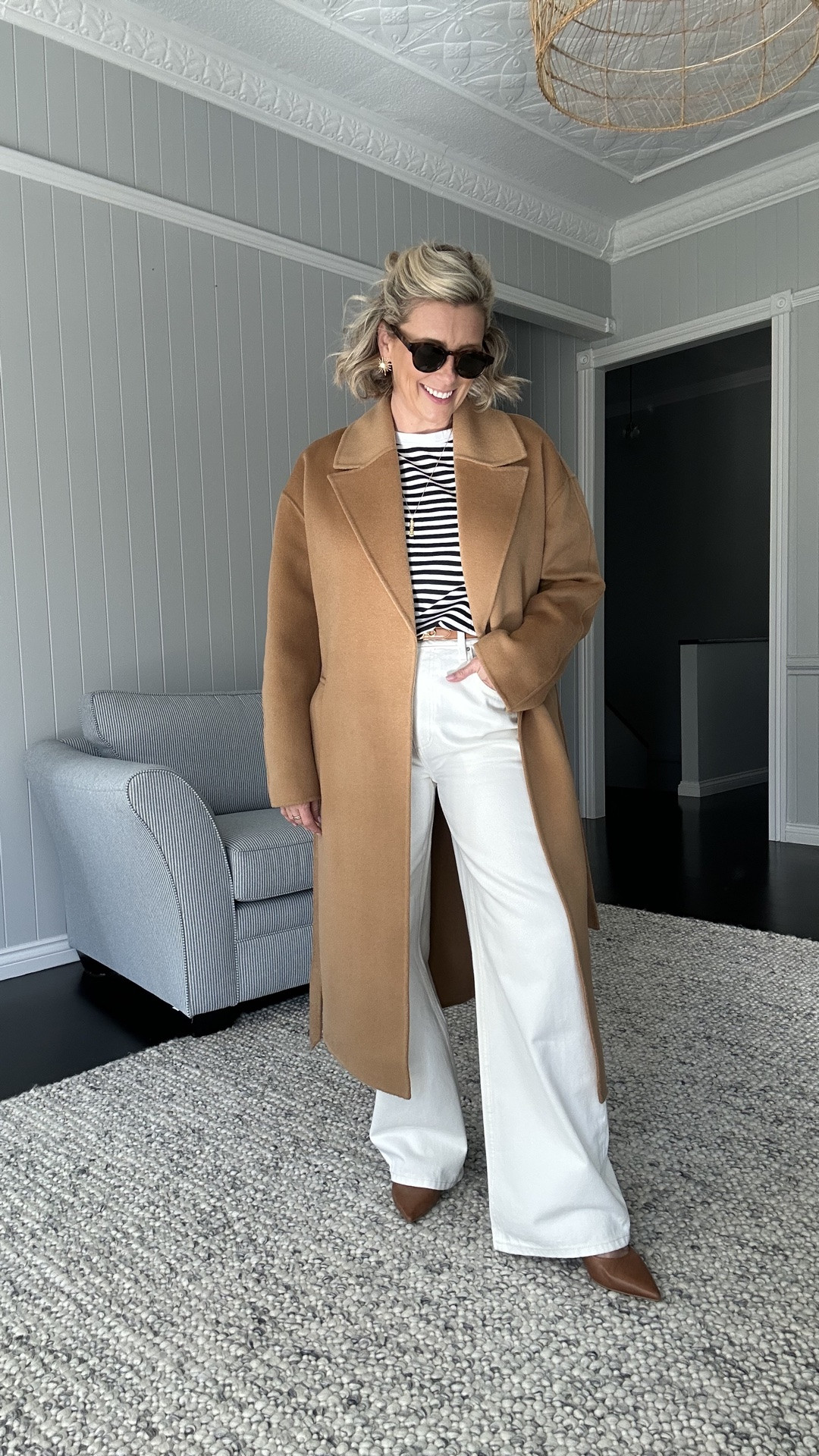 A classic combo of camel, navy and white stripes and white jeans. These are a low curve, mid rise jean and I like them so much I also have a darker blue denim version too. I’m wearing a size 28 in these. 

My coat is a size XS but I could go a Small for a little bit more of a relaxed fit. 

Belt is Witchery (not current). 
Earrings are Lanamara Studios.

#LTKaustralia #LTKwinter #LTKsale