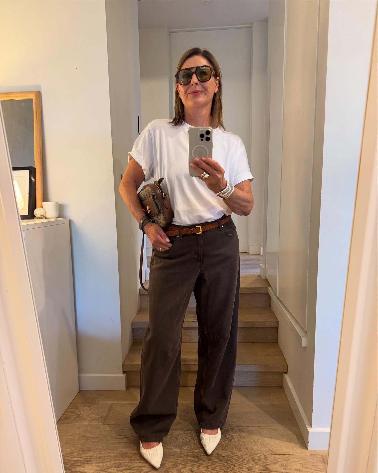 It’s Autumn !
As much as I love summer I’m dying to wear winter clothes. So I’m kind of mixing it up depending on the temperature.
The best news is that it’s jeans & T shirt weather.  With the occasional crop trench & blazer !

It’s cool enough for jeans right now which is great because I love wearing barrel leg jeans especially in brown! Check out my picks here of the best barrel jeans luxe to less.

And this fabulous white tee ?
It’s a winner !@lululemonausnz 
It’s organic cotton with a tiny bit of elastane so it’s incredibly soft and easy to wear.  The cut is sooo great : slouchy but not overwhelming. 
Skims but doesn’t cling. 
Easy to tuck in. The roomy sleeves give good arms. 
The neckline sits so well (FiFi approved!)

Styling tips: 
Roll up the sleeves a little of the tee, looks styled & polished . 
Add pointy white shoes for instant cool .
A designer YSL belt elevates the lewk & adds a contrast to the jeans.
Grab your favorite bag , couldn’t decide which was best , the brown gucci bag or suede Arket. 
Remember shoes & bags don’t need to match …Done ! 

I’m wearing a size large in the tee and size 42 in jeans.

Shop it all here ! 

#LTKaustralia #LTKstyletip #LTKautumn