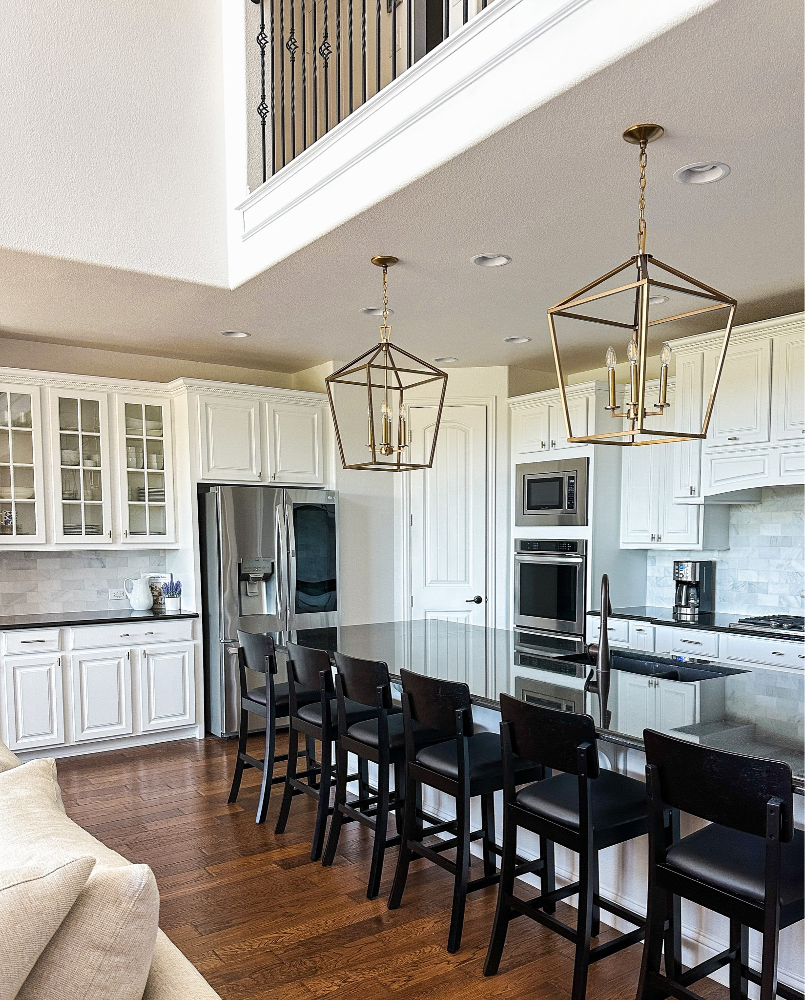 Loving how our kitchen renovations turned out including these light fixtures and black bar stools! 

#ltkhome #barstools #counterstools #ltkkitchen 