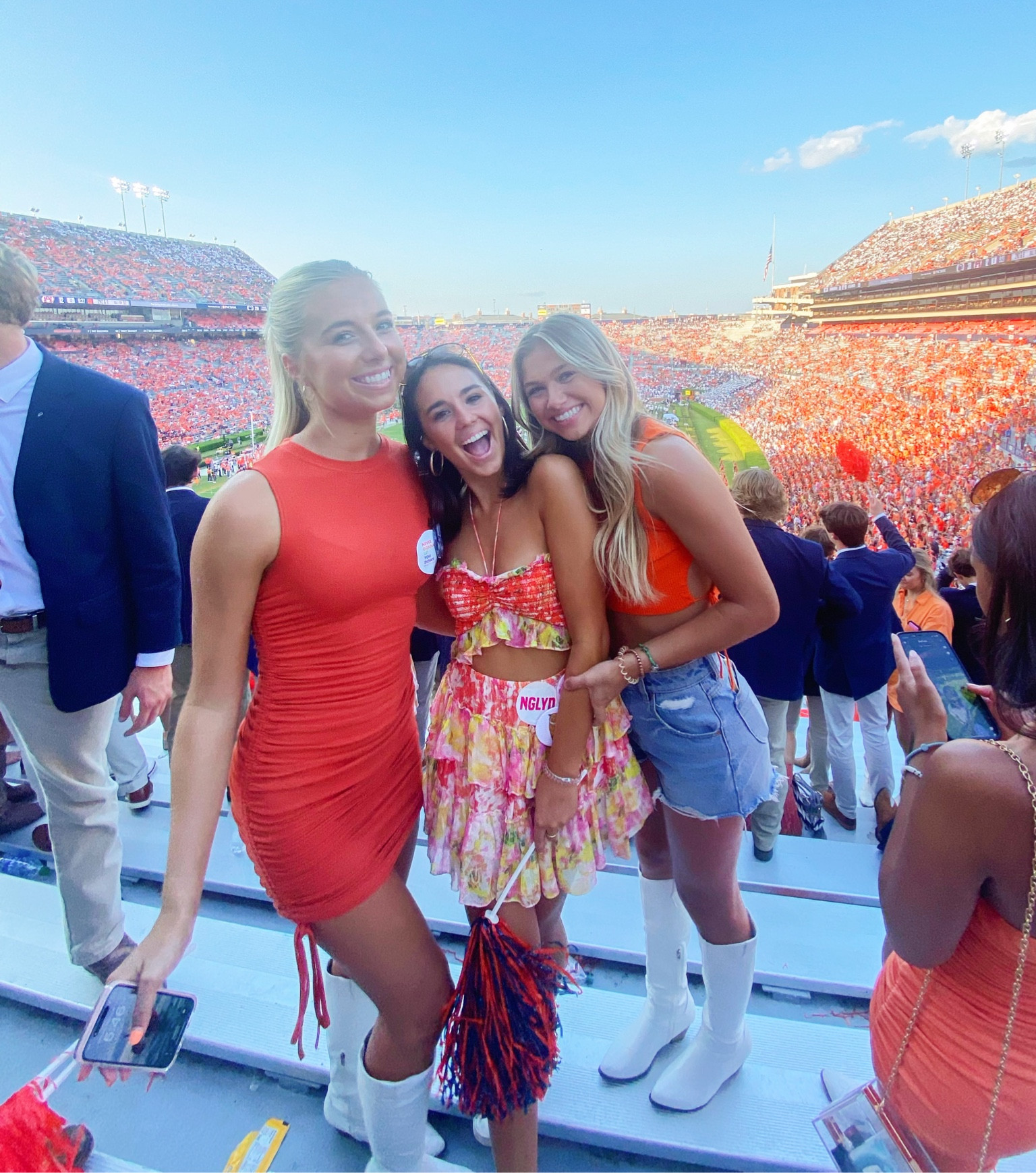 gameday in auburn!! dress is from fashion pass but revolve sells the same one in another color!! you can use my fashion pass code “EMMA30A” for $$ off!!!🧡🧡🧡