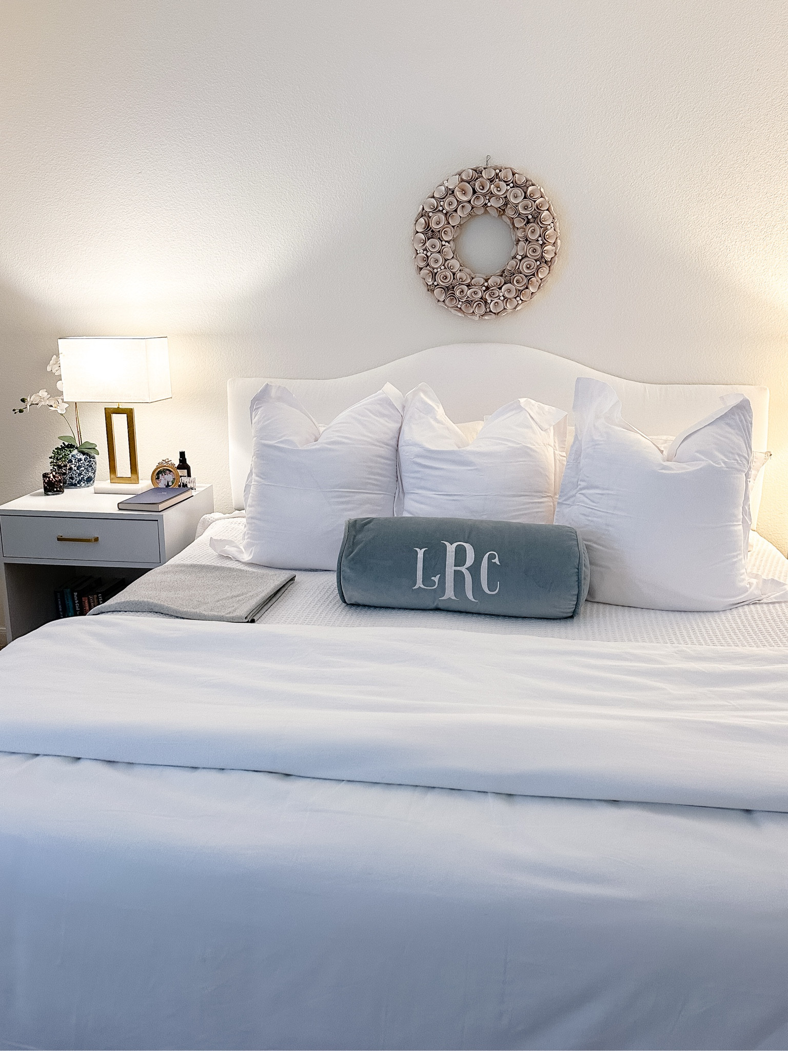 Linked what I could of our bedding! Wreath is old from Target, bedsides tables + bolster pillow were custom made. Square pillows are 28x28 with 26x26 covers

#LTKHome #LTKStyleTip