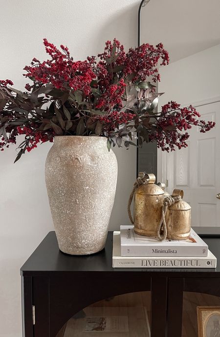 Affordable holiday stems on sale for 50% off right now. Using 3 stems here.

Winter greenery, holiday stems, entryway styling, Christmas decor, Christmas stems, arch cabinet, foyer decor, target style, arch mirror, entryway mirror, Christmas bells

#LTKSeasonal #LTKHolidaySale #LTKhome