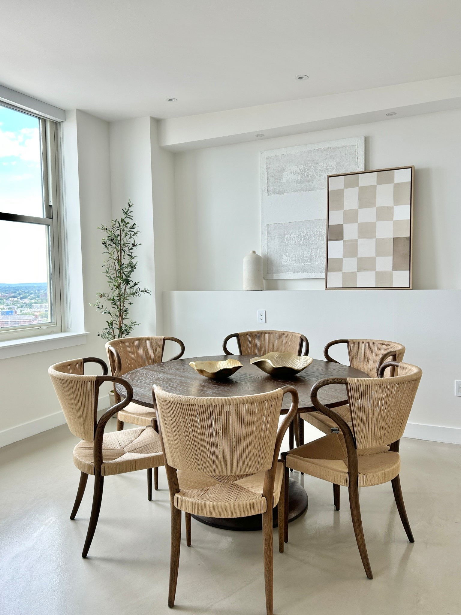 Round dining table with high backed woven chairs.

#diningchair #diningtable #diningroom

#LTKHome