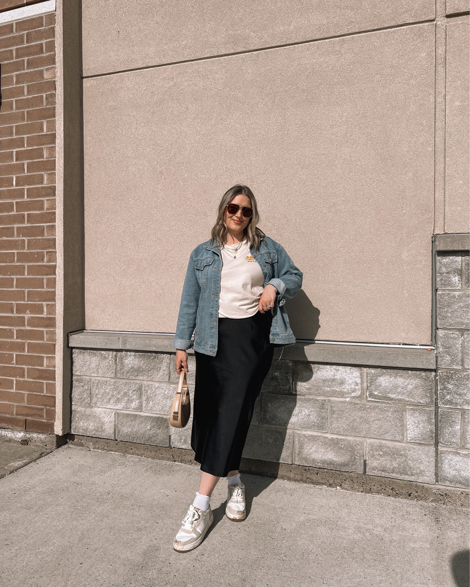 Midsize spring outfit - black satin midi skirt (size L), oversized graphic tee (L), Amazon denim jacket (M), Amazon crescent bag, neutral sneakers 

Casual spring outfits, spring style


#LTKmidsize #LTKfindsunder100 #LTKSeasonal