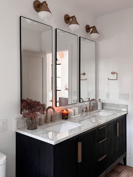 Adding three mirrors rom our bathroom made such a statement! I was nervous but I love how unique the design is and how it elevates a traditional bathroom layout. 

#LTKstyletip #LTKhome