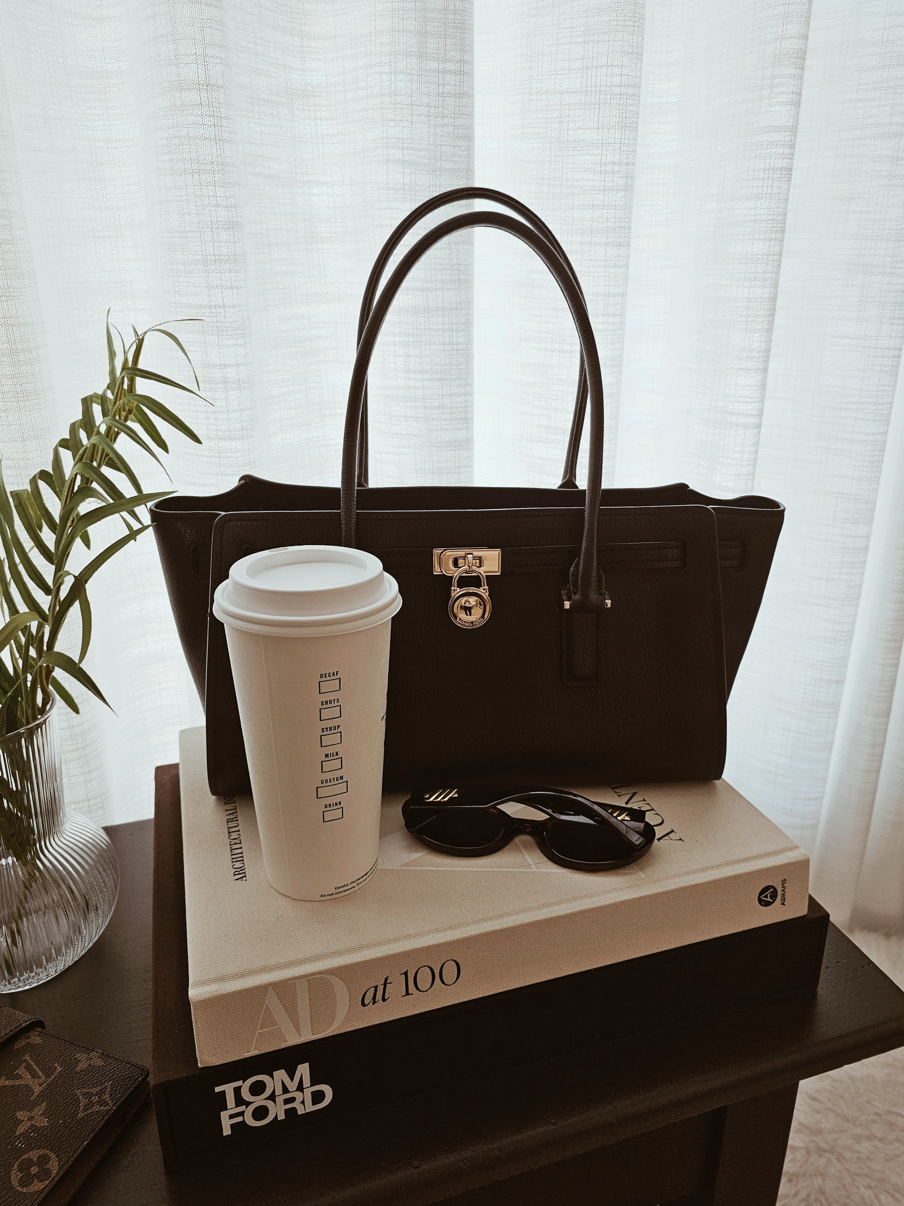 Monday quiet luxury look.Structured black tote bag, oversized sunglasses, coffee run essentials, neutral coffee table books, chic home decor styling, minimal lifestyle aesthetic.Classic black work bag, gold hardware tote, modern sunglasses, coffee aesthetic, luxury home decor books, everyday essentials.

#LTKSpringSale #LTKHome #LTKmorningroutine