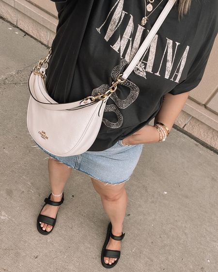 Casual midsize summer ootd - graphic tee (XL), denim mini skirt (14), Coach crossbody bag, black sandals



#LTKsummer #LTKmidsize #LTKbag