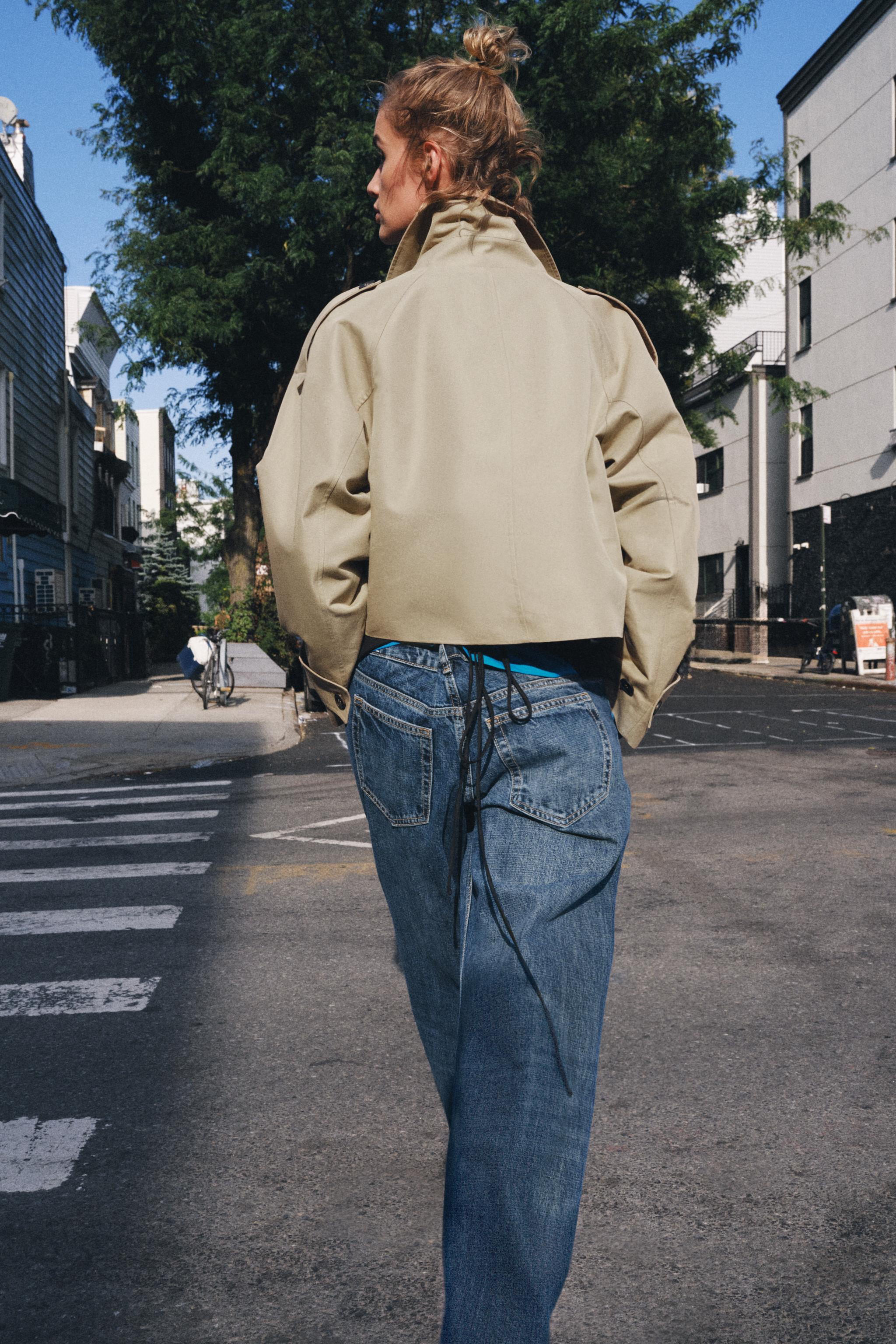 Short trench-style jacket with a high, convertible collar and long sleeves finished with button-t... | Zara Canada