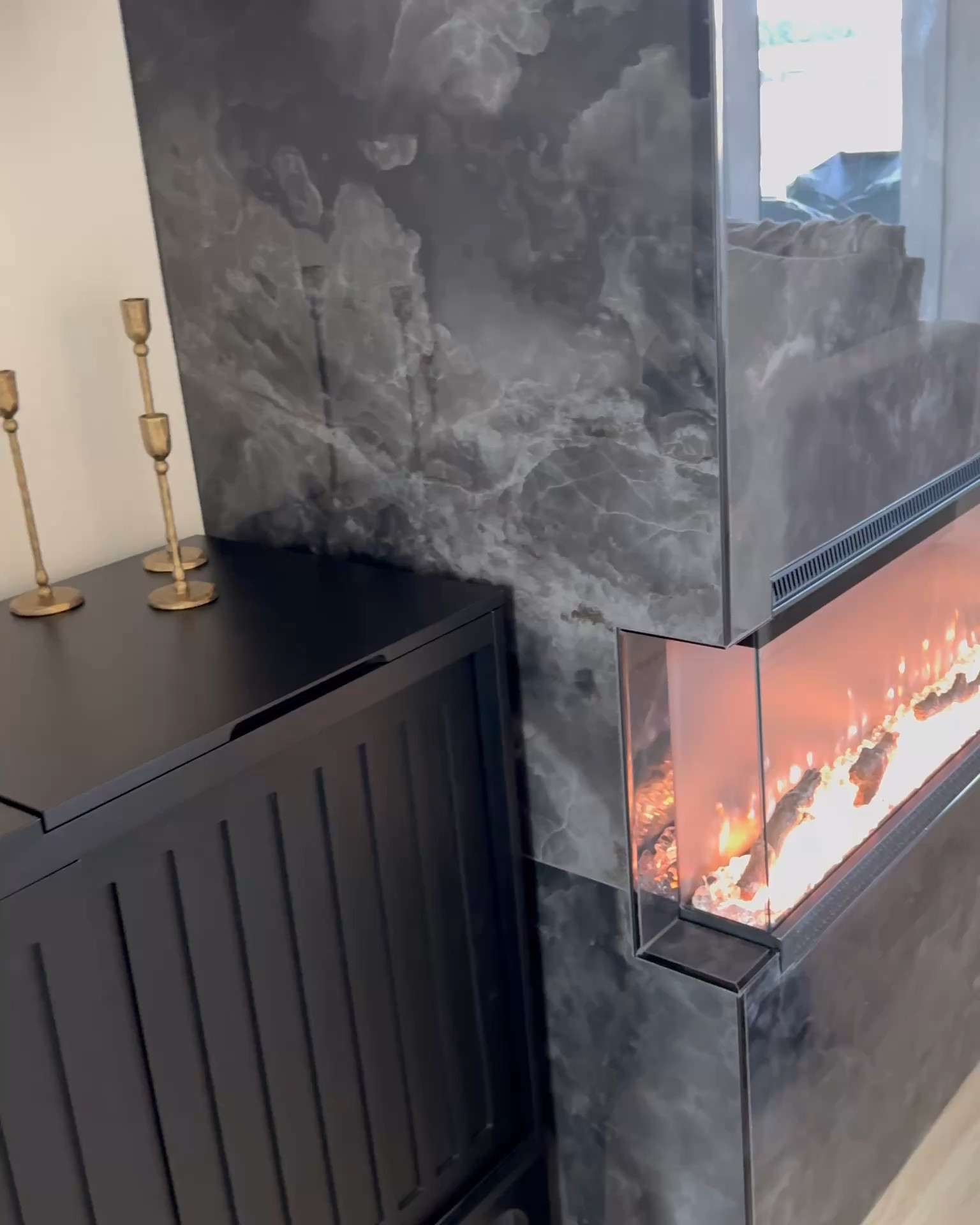 My three sided fireplace was budget friendly and it’s so nice! Works with a remote and has different light settings/colors! #fireplace #electricfireplace #modernfireplace #threesidedfireplace

#LTKHome