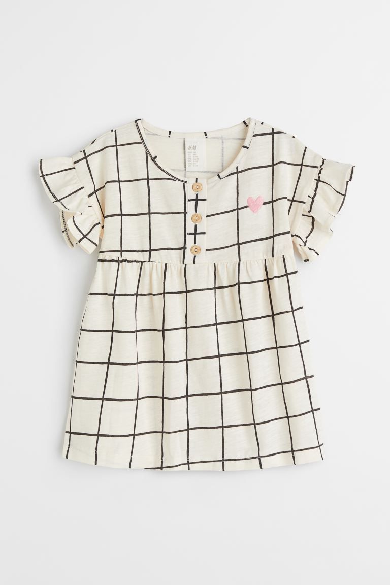 Dress in soft jersey. Button placket, short sleeves with flounced cuffs, and a gathered seam at u... | H&M (US + CA)