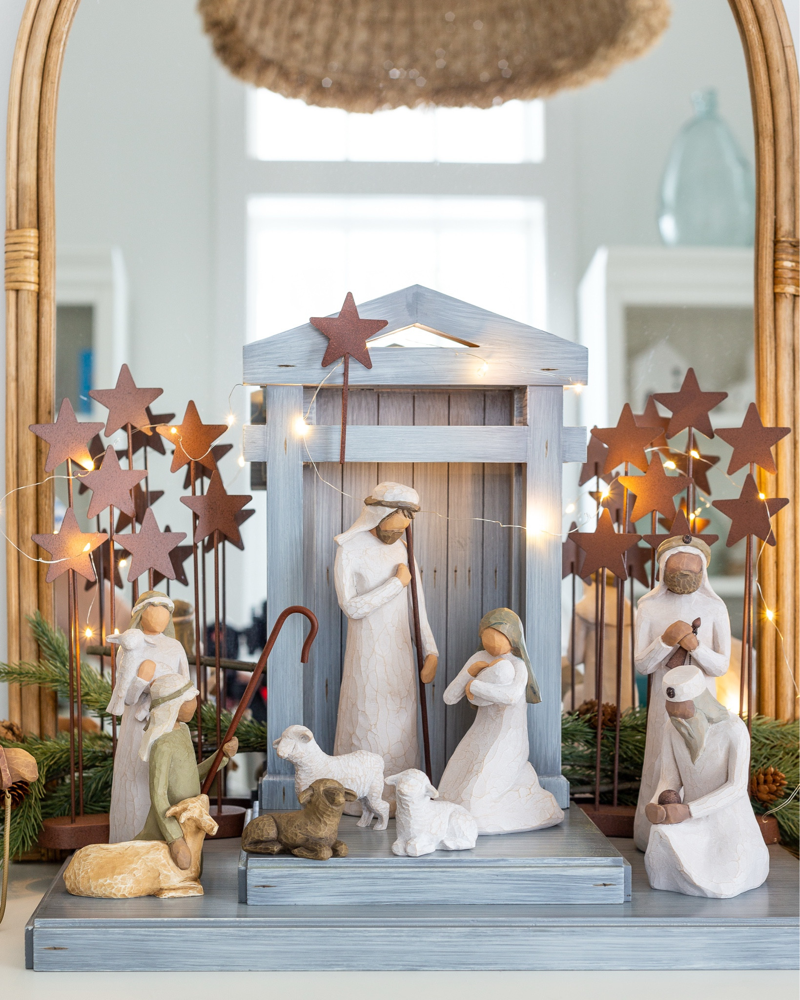 Our cherished nativity scene featuring a slate blue creche, wooden nativity people, stable animals, shepherds, three wisemen and more. We also love these coordinating stars and carved wood cypress trees. I added in two sprigs of this greenery with pine cones for color. Also linking our desk set where we display this, the twinkle lights I used,  as well as the woven chandelier in the room. This makes for a great collectors set, as you can gift the base nativity and then add various scenes as gifts in later years. #ltkholiday #ltkhome #ltkseasonal #ltkfindsunder100 #ltkstyletip #ltkgiftguide

#LTKFindsUnder100 #LTKHome #LTKHoliday