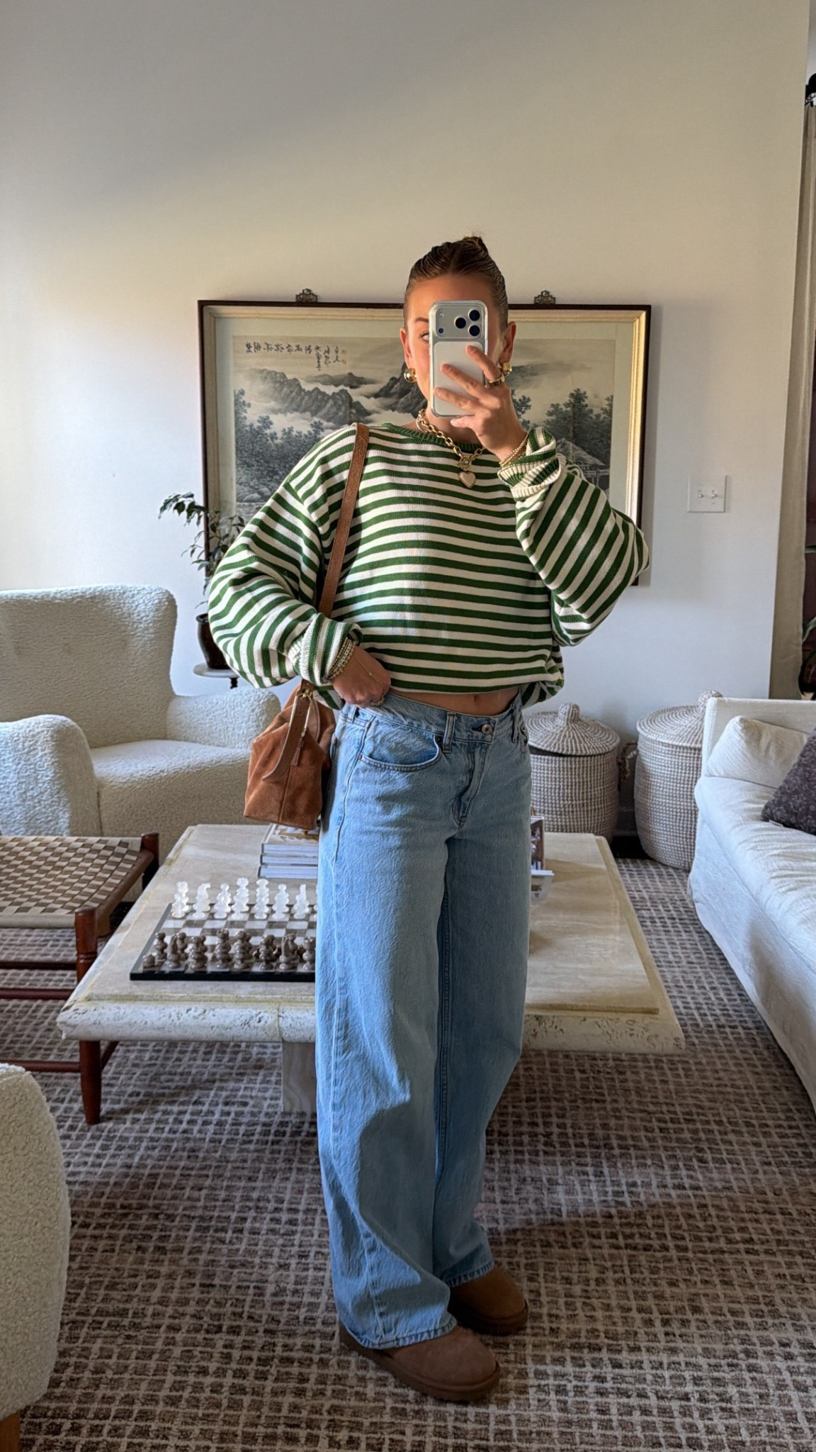 11/4/25 Casual fall outfit of the day 🍂 Wearing my cozy UGG mini boots, Abercrombie ultra loose jeans, and my green striped sweater from Sonderhaus (wearing size S). The perfect comfy, casual combo for a crisp fall day. 🤎

#LTKSeasonal #LTKShoeCrush #LTKStyleTip