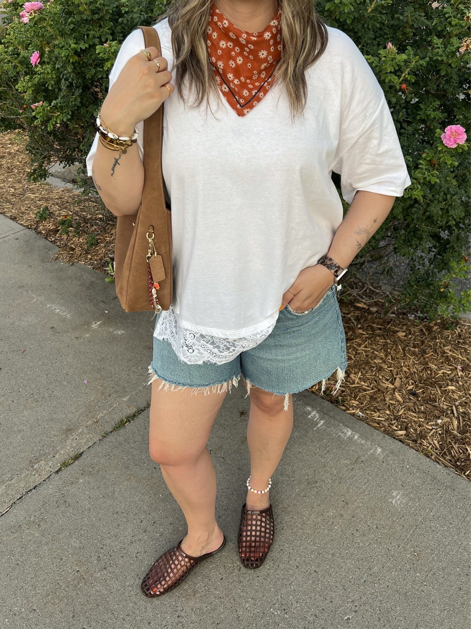 Easy summer outfit! Wearing L in the lace trim tee and sized up to 32 in the denim shorts for a loose fit. I’m a 9.5-10 shoe and wear a 10 in the jelly shoes. Canadian tee & shoes links are under “similar products”. Also linked similar bandanas!

#LTKsummer #LTKmidsize #LTKsale