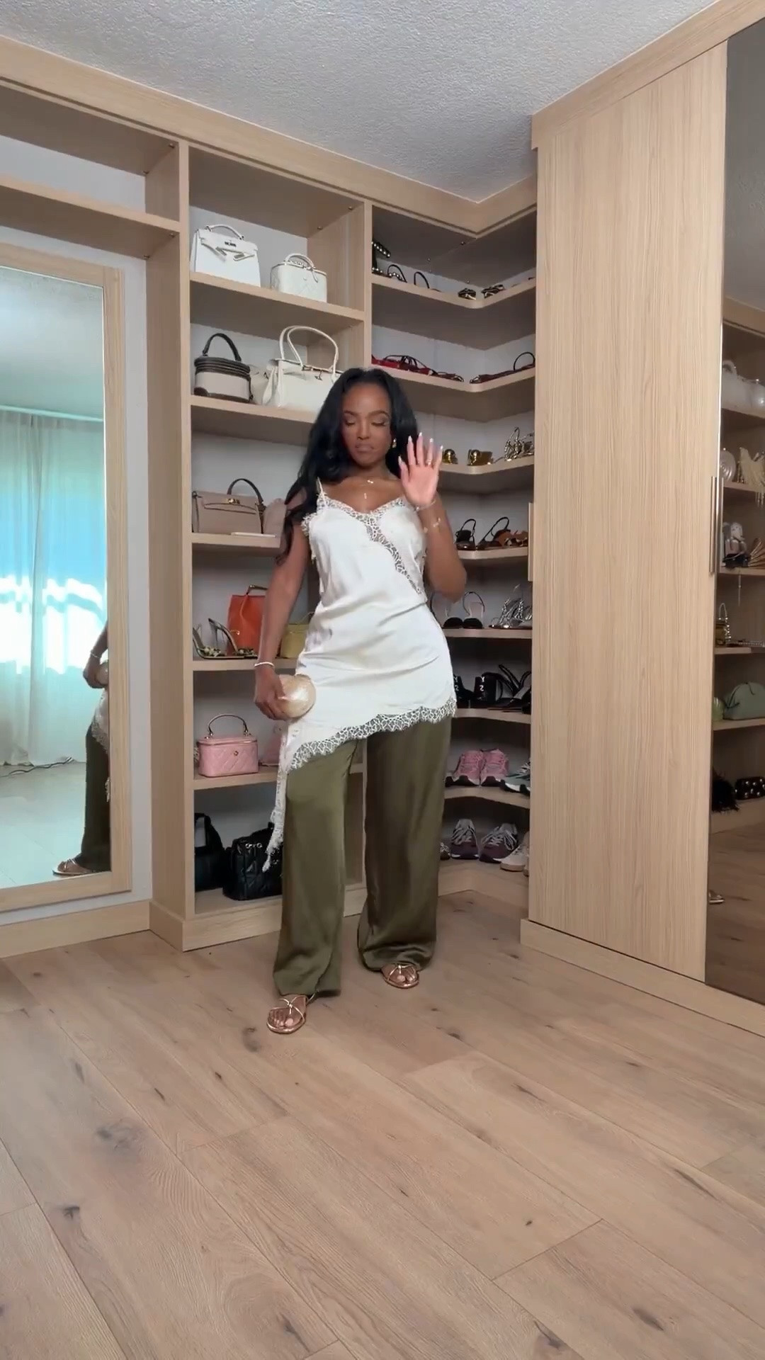 Hi Babes!

Okay this look is effortlessly chic. The lace-trim camisole layered over the olive wide-leg pants gives that elevated boutique feel that looks like you spent way more than you did.

The asymmetrical lace detail makes this top feel so special, and I love how the relaxed fit balances perfectly with the flowy trousers. It's feminine, sophisticated, and one of those outfits that gets compliments every single time.

Where to wear this:
• Vacation dinners
• Winery afternoons
• Date nights
• Girls' night out
• Resort evenings

Accessories:
A neutral clutch, delicate jewelry, and simple sandals are all this outfit needs. The lace detailing is the statement, so keeping everything else understated makes the look feel even more expensive.

Everything is linked below

xx Kira | IG: KirasFashionFinds

34D - 27 - 40 • Size Small or 4