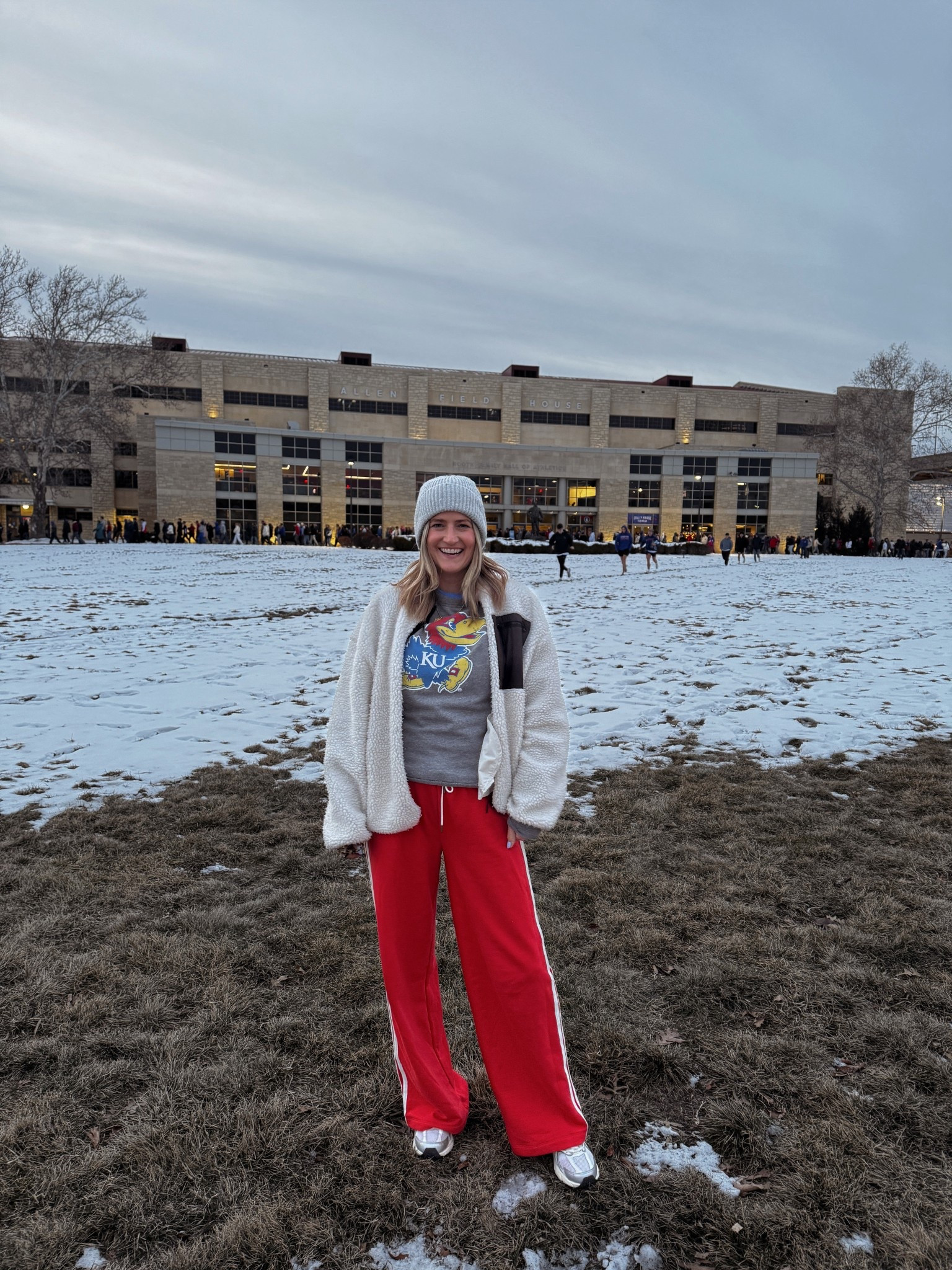 Red sweatpants (wearing size small), new balance sneakers