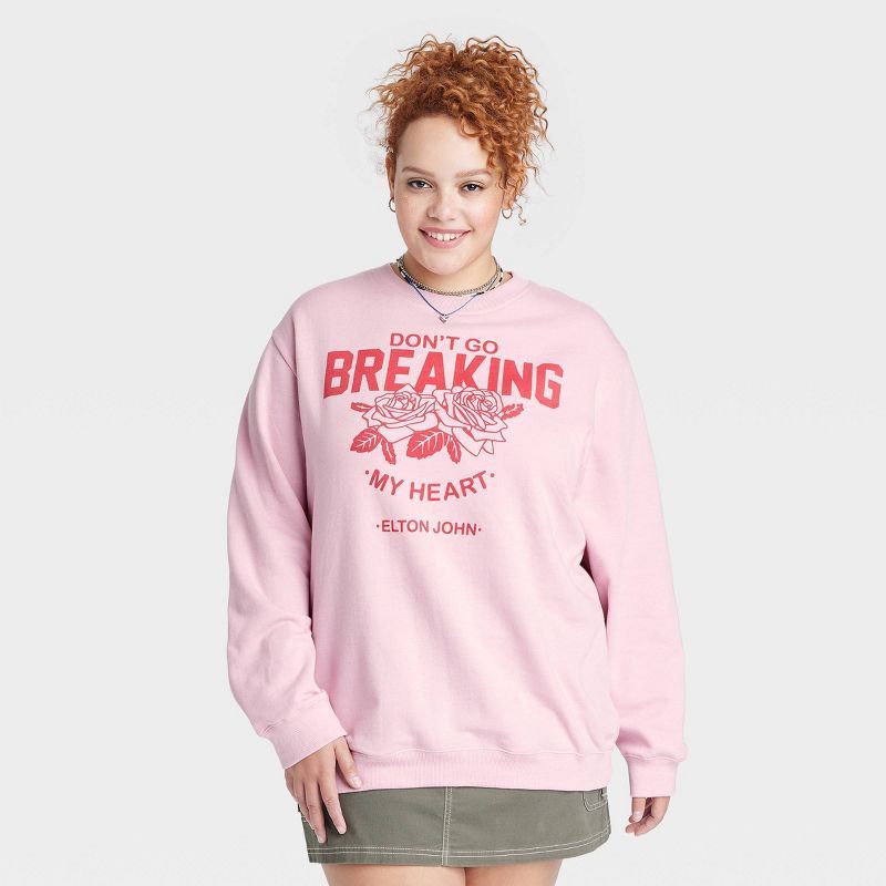 Women's Elton John Breakin' My Heart Graphic Sweatshirt - Light Pink | Target